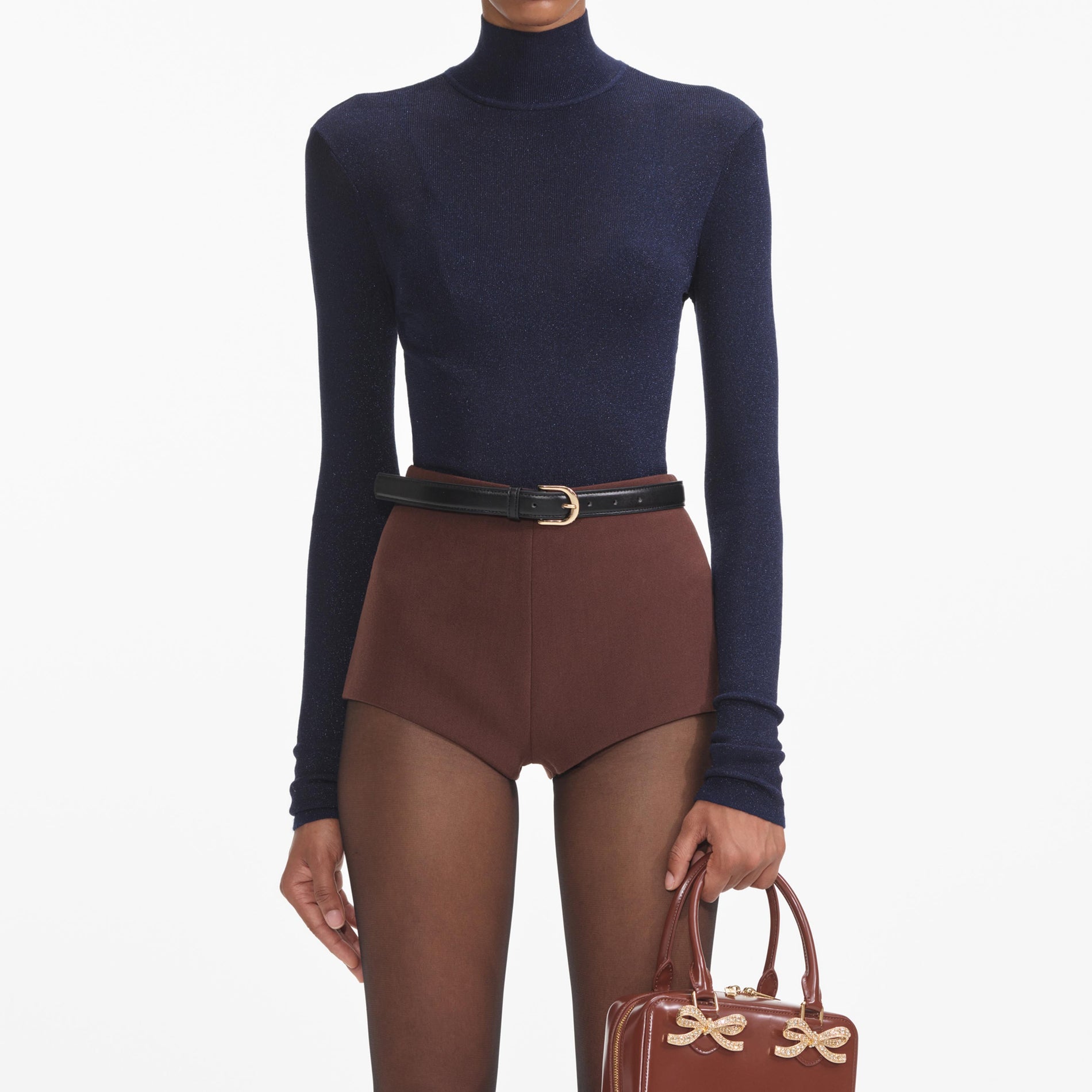 A close up of a woman wearing the Brown Stretch Crepe Shorts