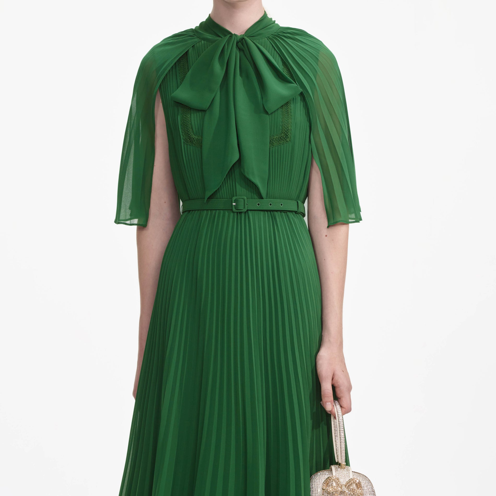 A close up of a woman wearing the Green Chiffon Cape Midi Dress