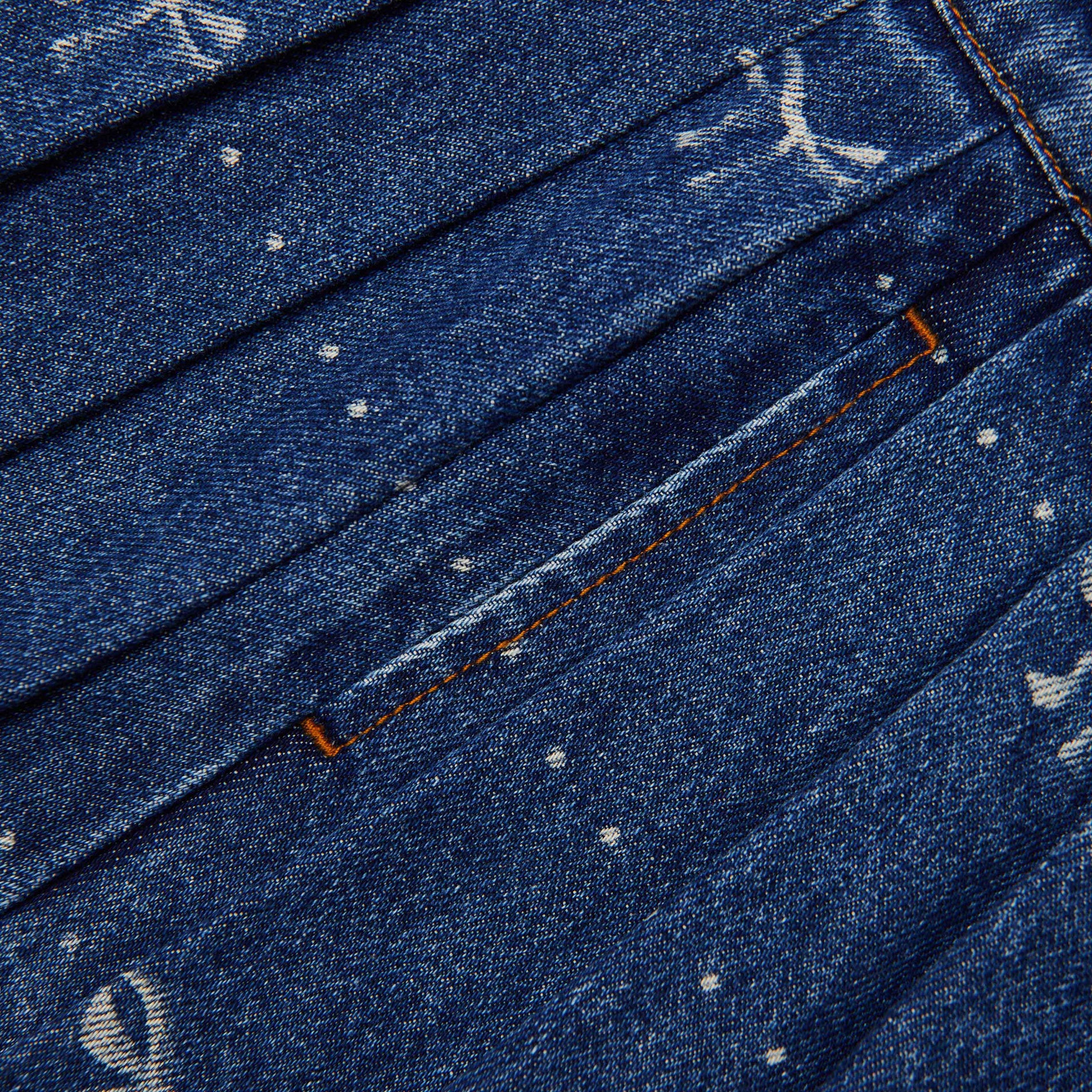 Back view of a woman wearing the Denim Bow Print Skirt