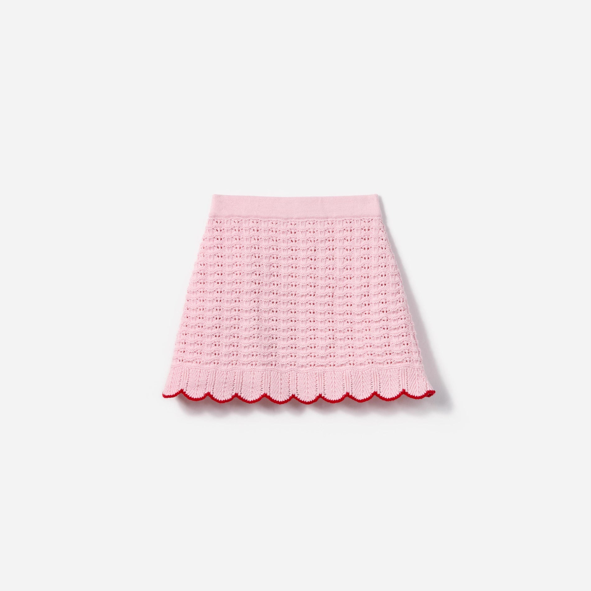 Side view of a woman wearing the Pink Textured Knit Heart Detail Skirt
