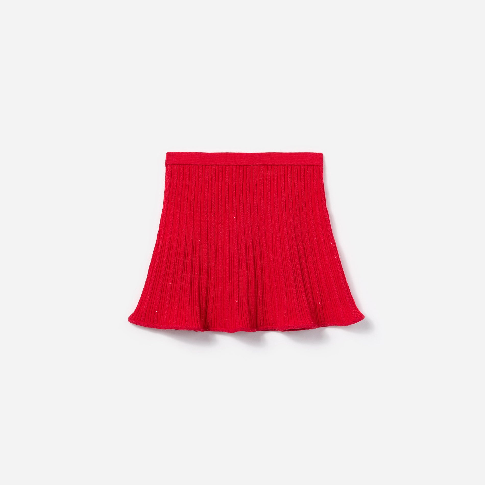 Side view of a woman wearing the Red Ribbed Knit Skirt