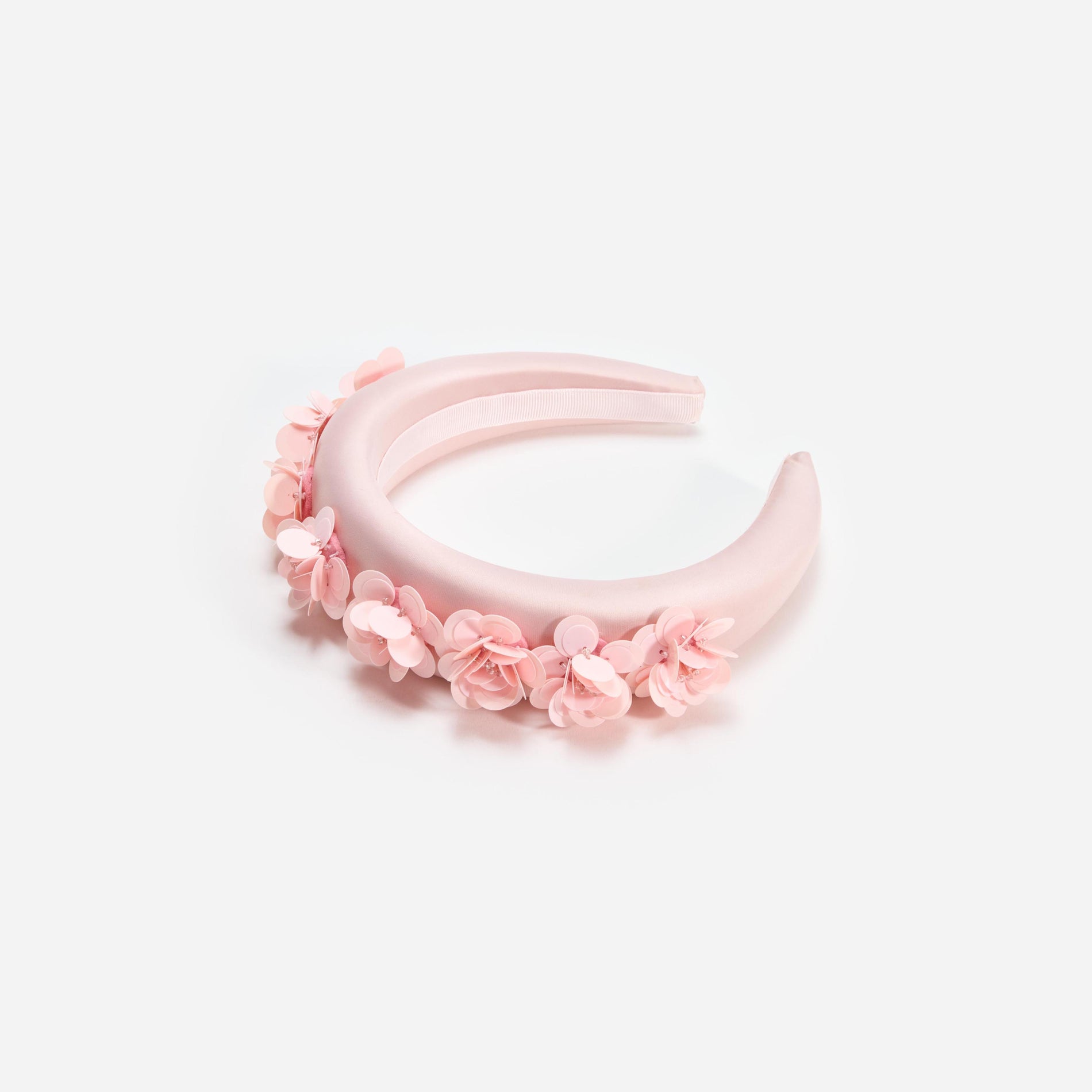 Side view of a woman wearing the Pink Satin 3D Flower Headband