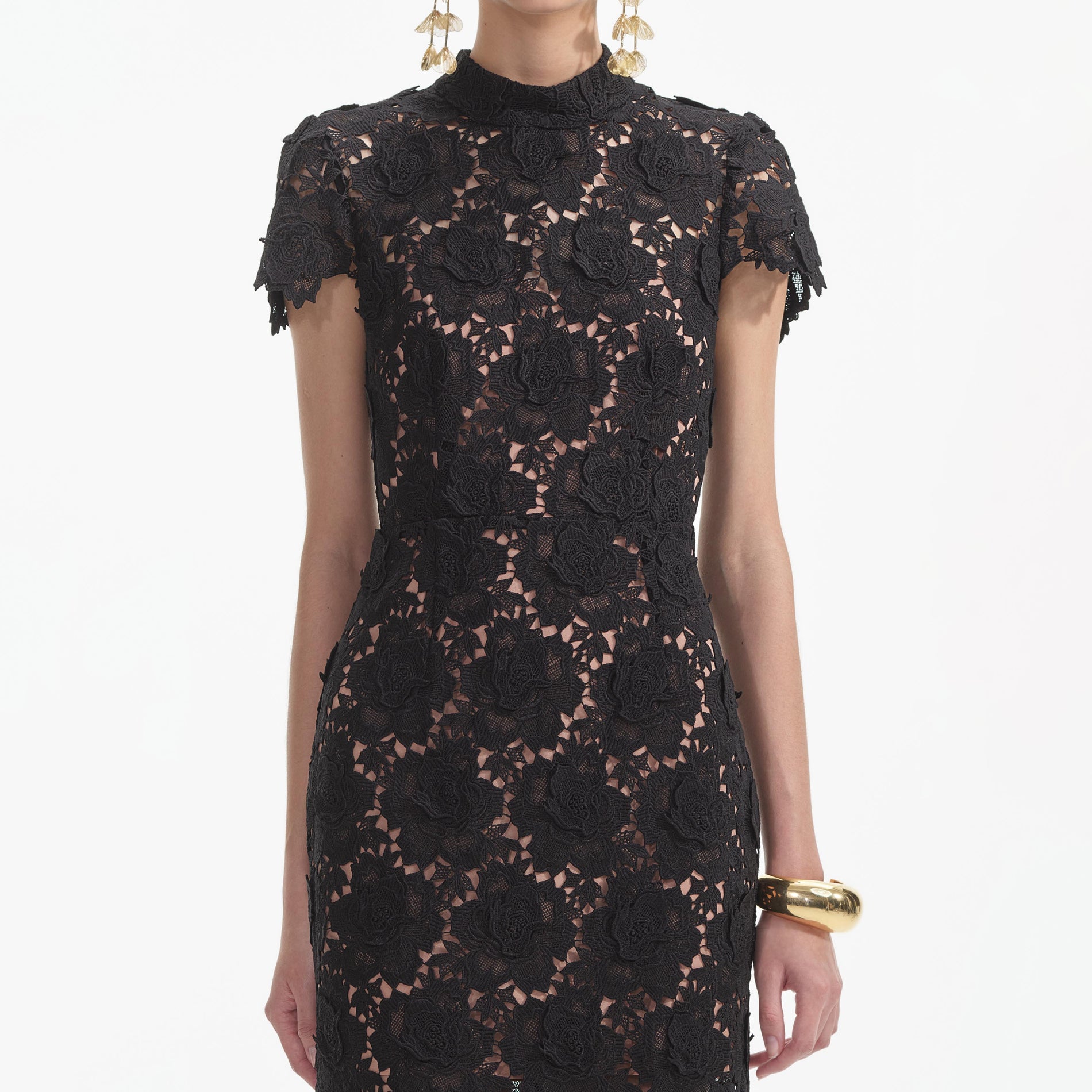 A close up of a woman wearing the Black Flower Lace Midi Dress