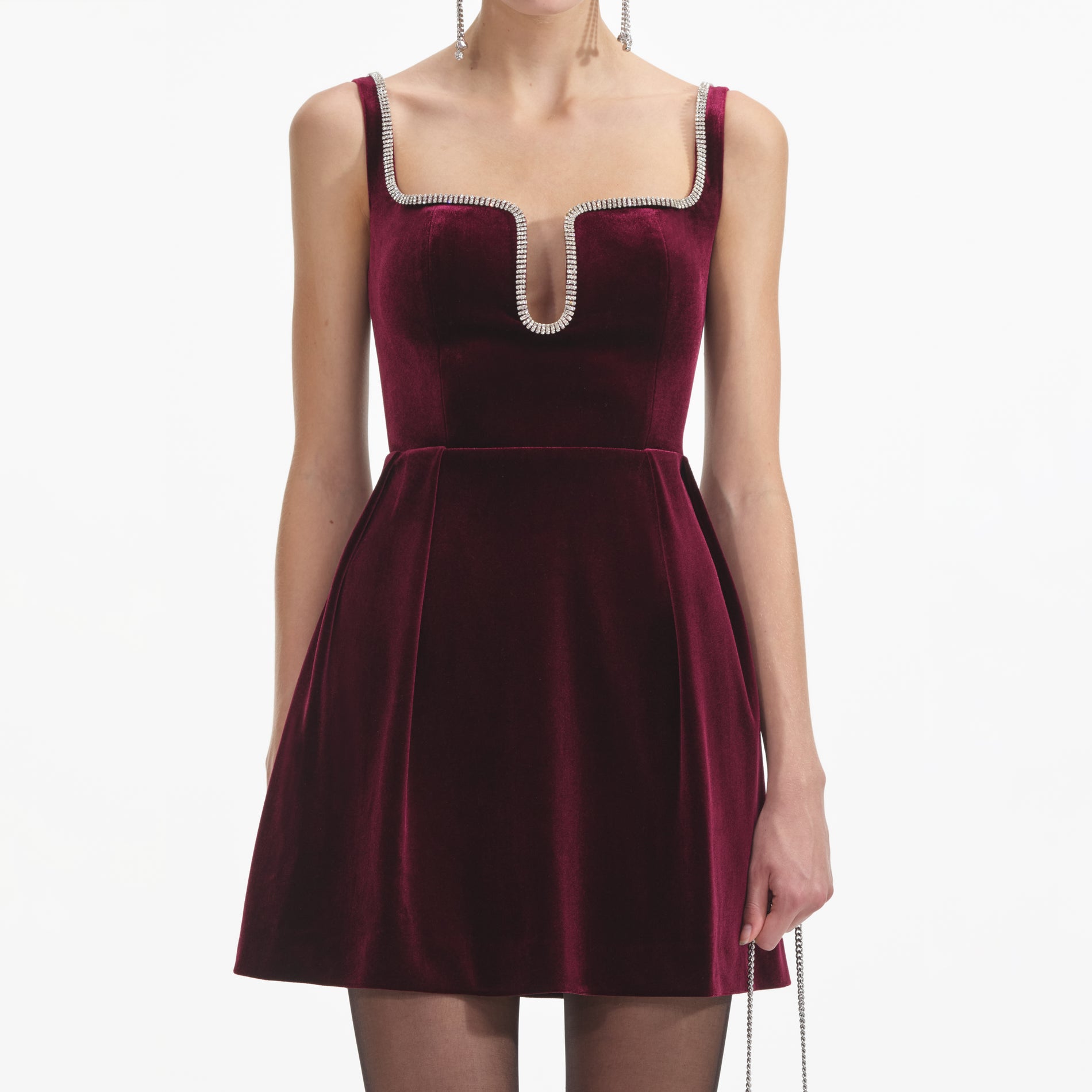 A close up of a woman wearing the Burgundy Velvet Mini Dress