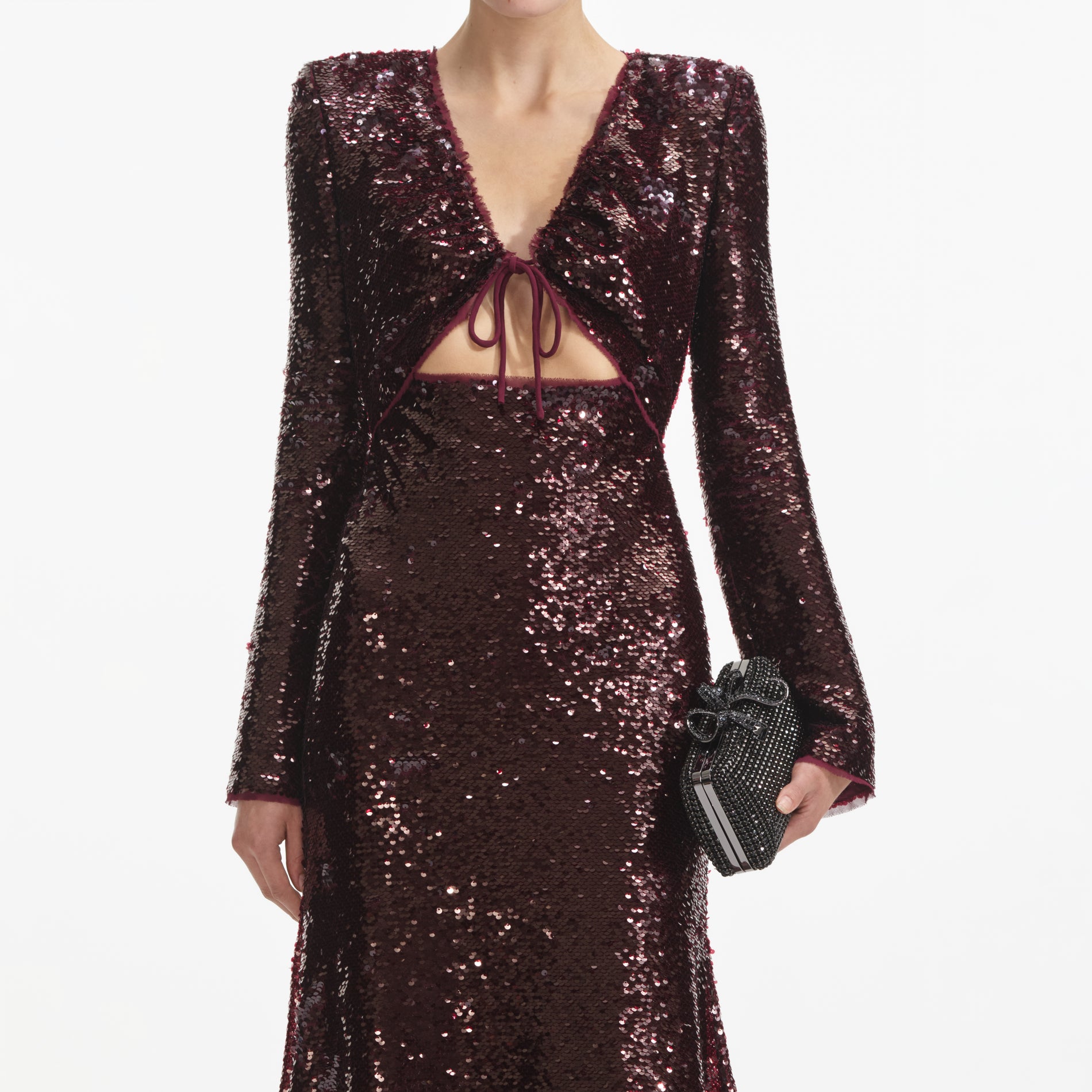 A close up of a woman wearing the Burgundy Sequin Midi Dress