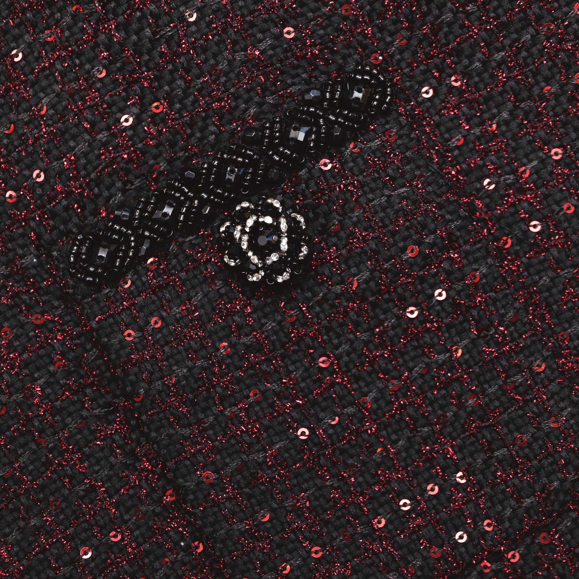A close up of the fabric for the Black Metallic Boucle Midi Skirt