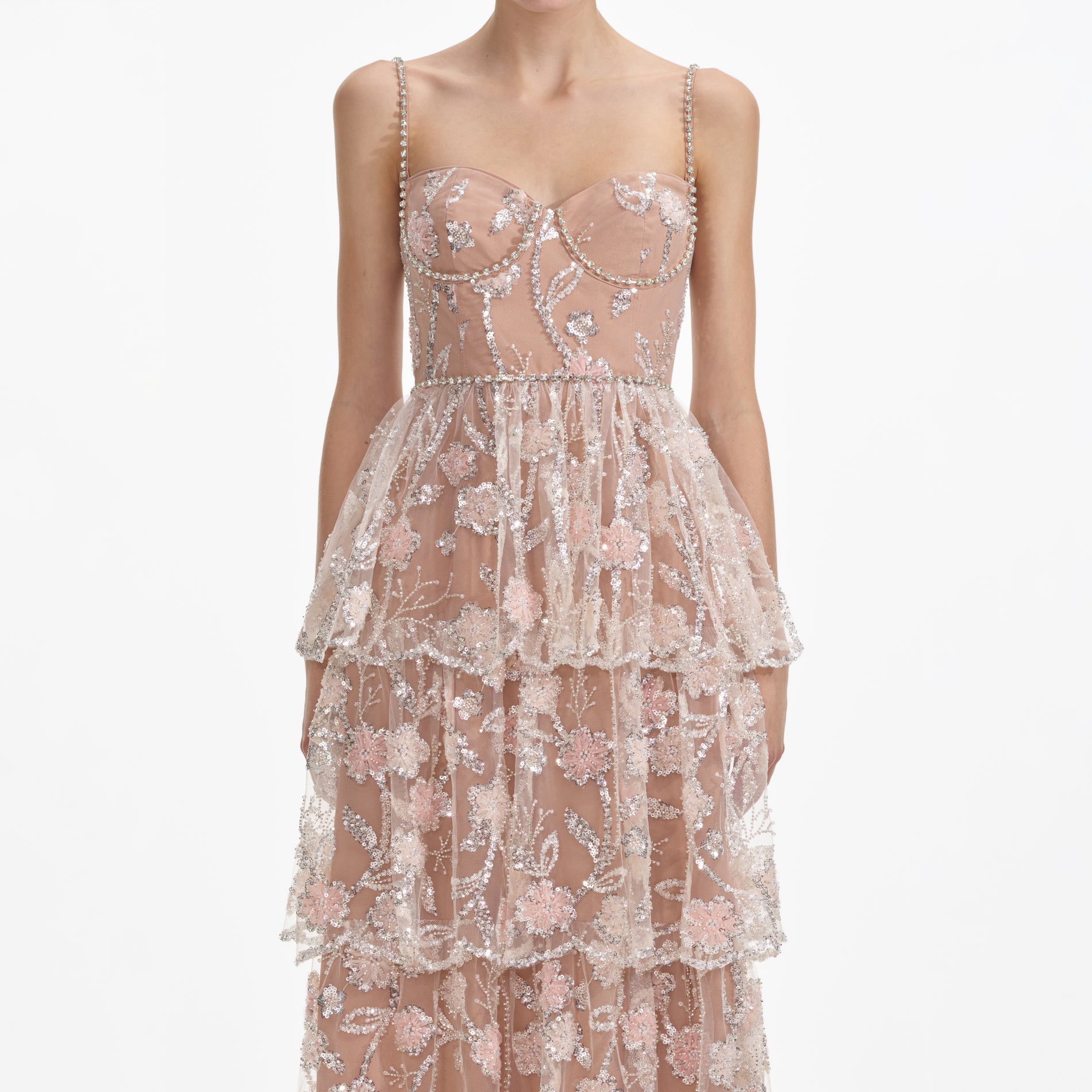 A close up of a woman wearing the Flower Sequin Tier Maxi Dress