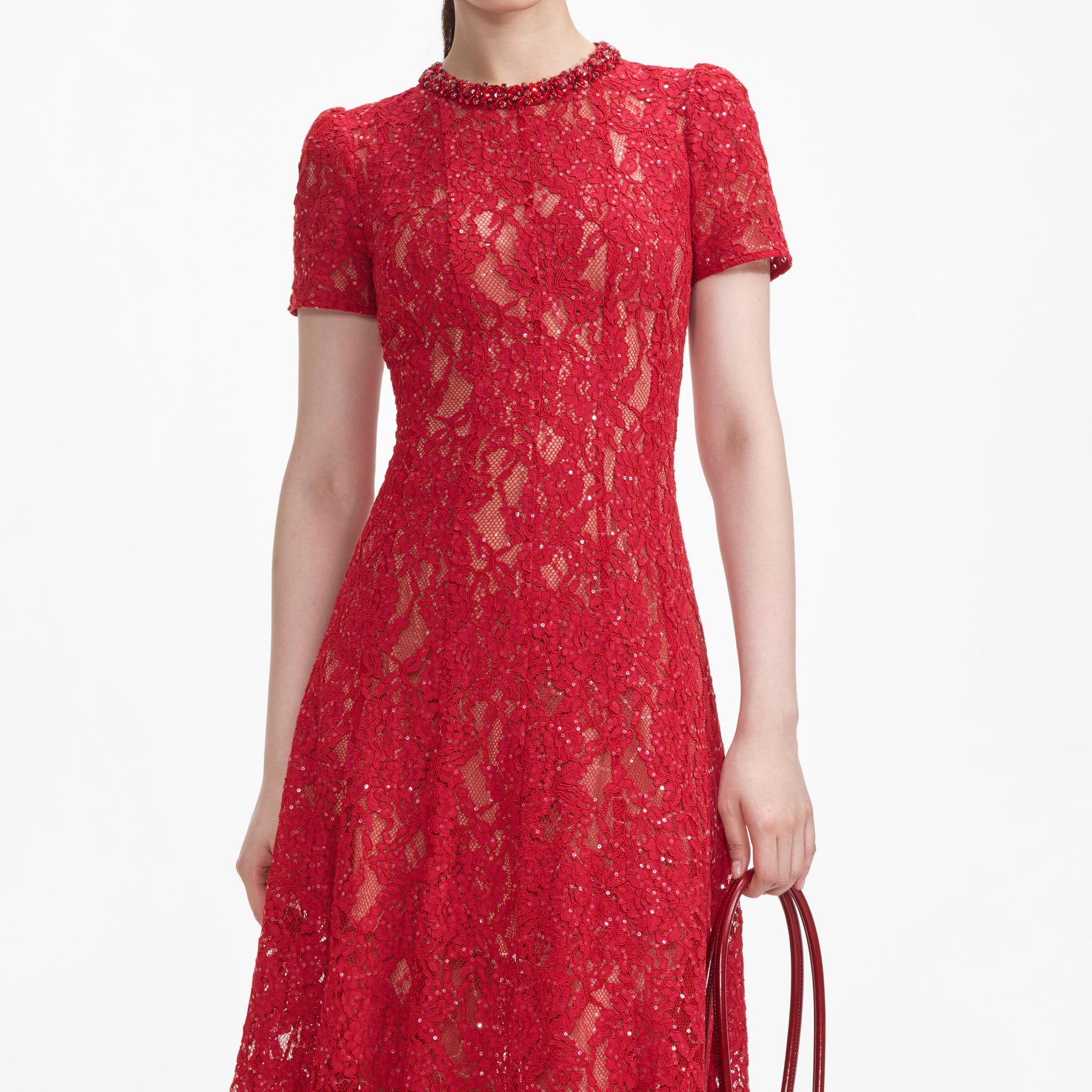 A close up of a woman wearing the Red Sequin Lace Midi Dress