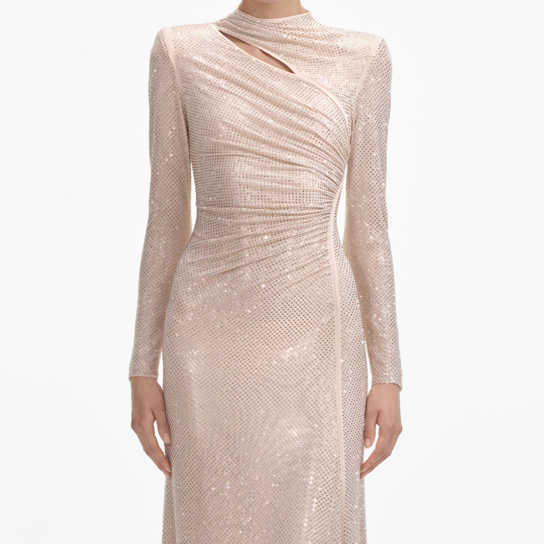 A close up of a woman wearing the Gold Rhinestone Mesh Cut Out Maxi Dress