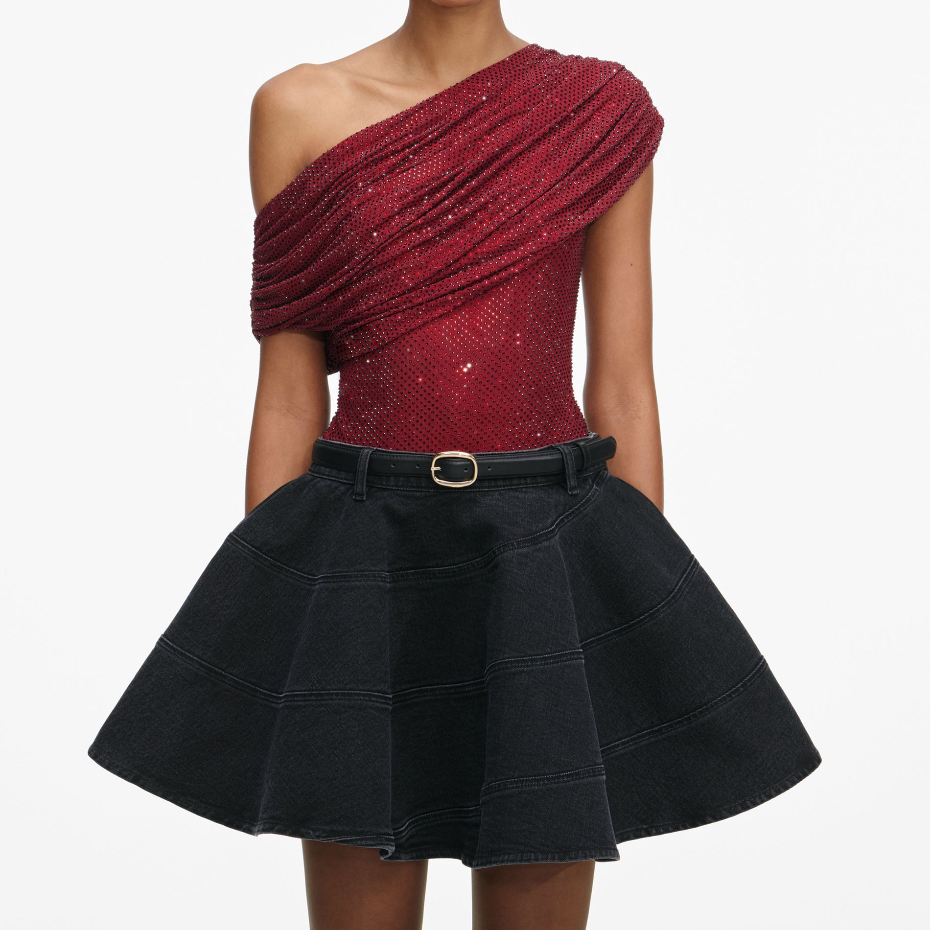 A close up of a woman wearing the Burgundy Rhinestone Drape Top