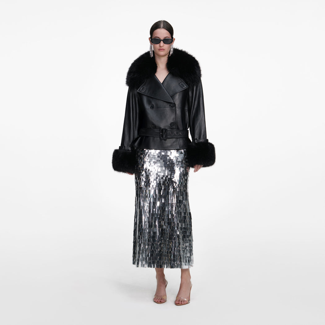 Front view of a woman wearing the Black Belted Leather Jacket