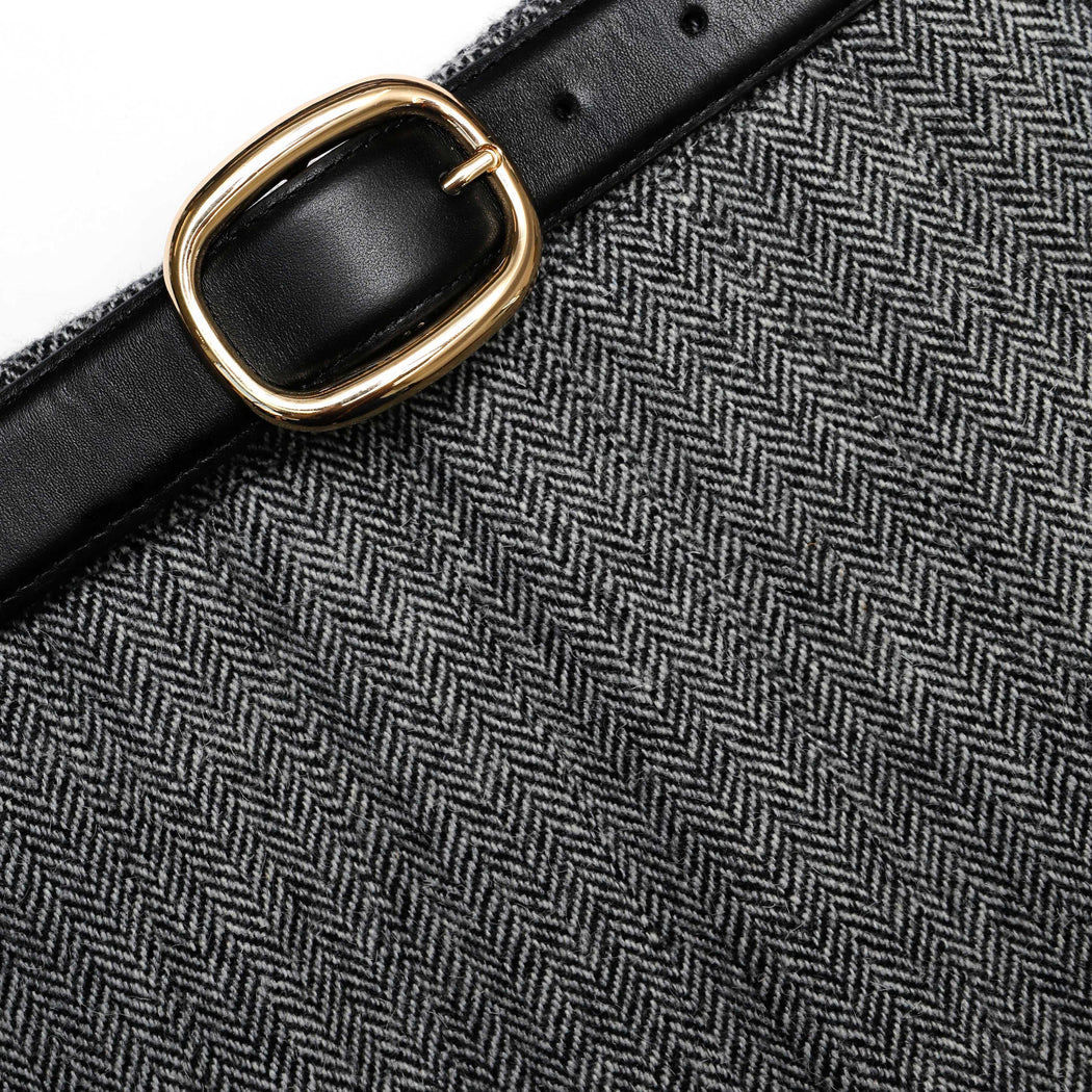 A close up of the fabric for the Grey Herringbone Pleated Midi Skirt