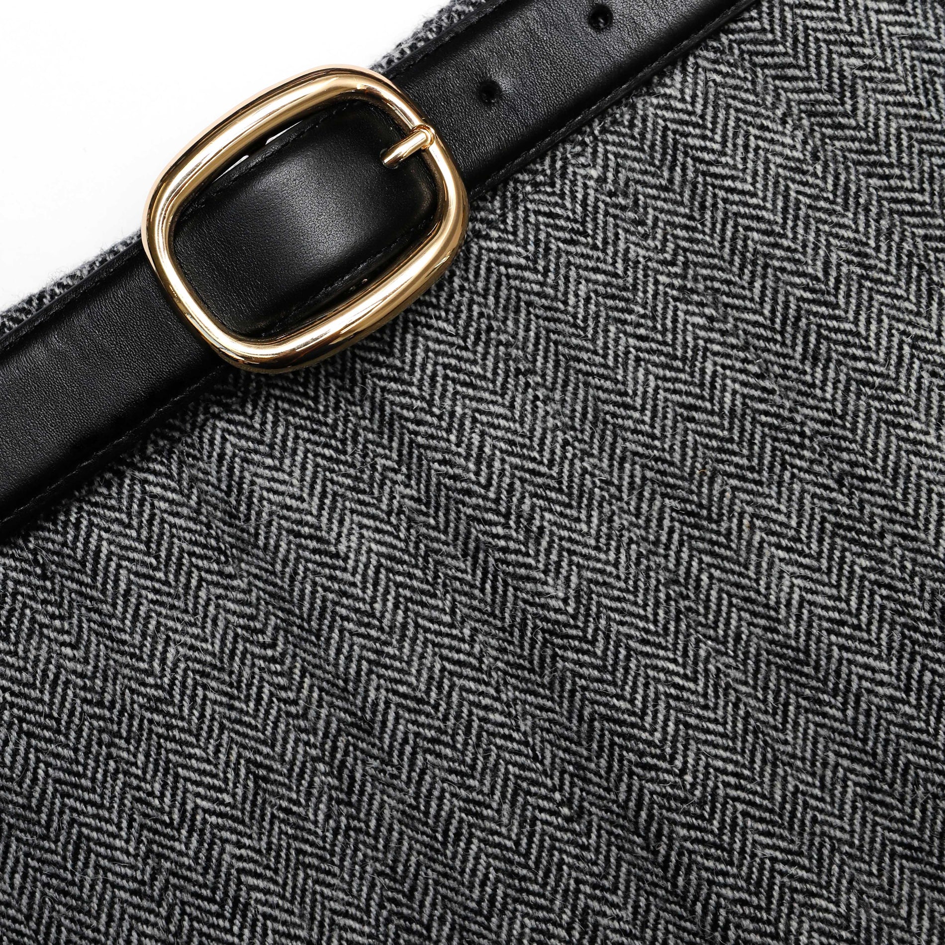 A close up of the fabric for the Grey Herringbone Pleated Midi Skirt