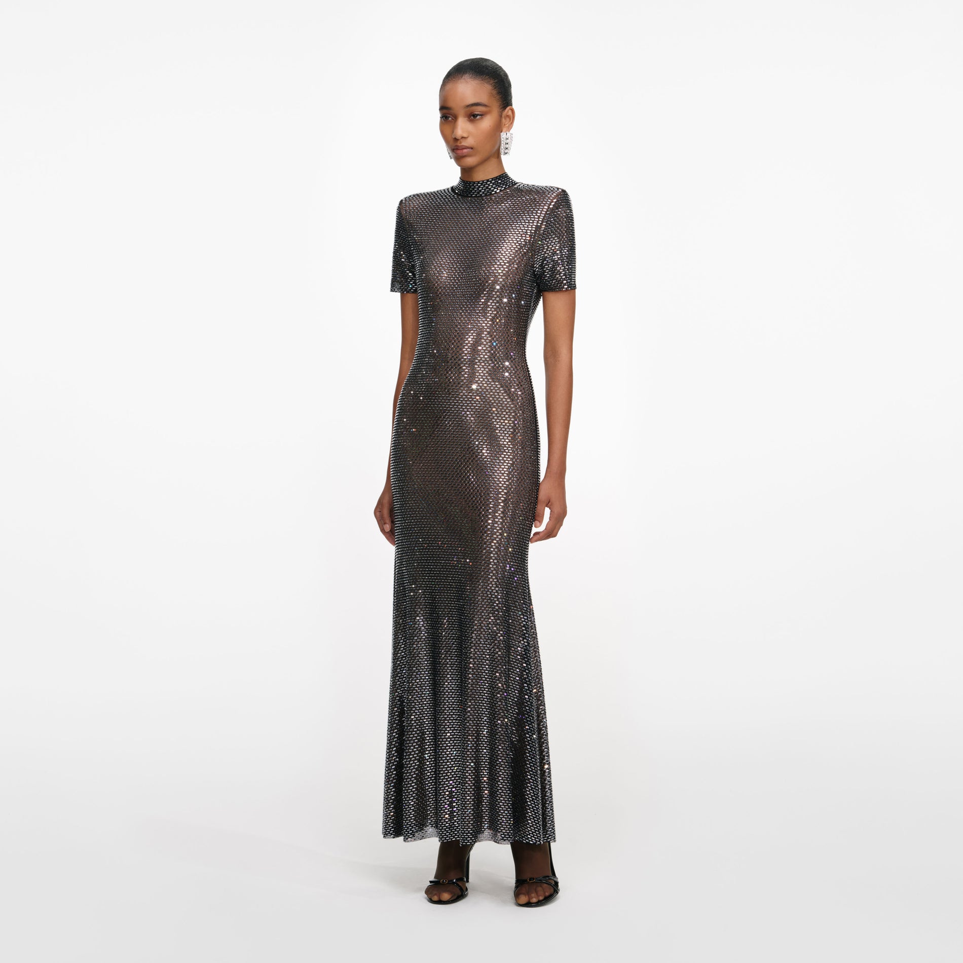Side view of a woman wearing the Gunmetal Rhinestone Mesh Midi Dress