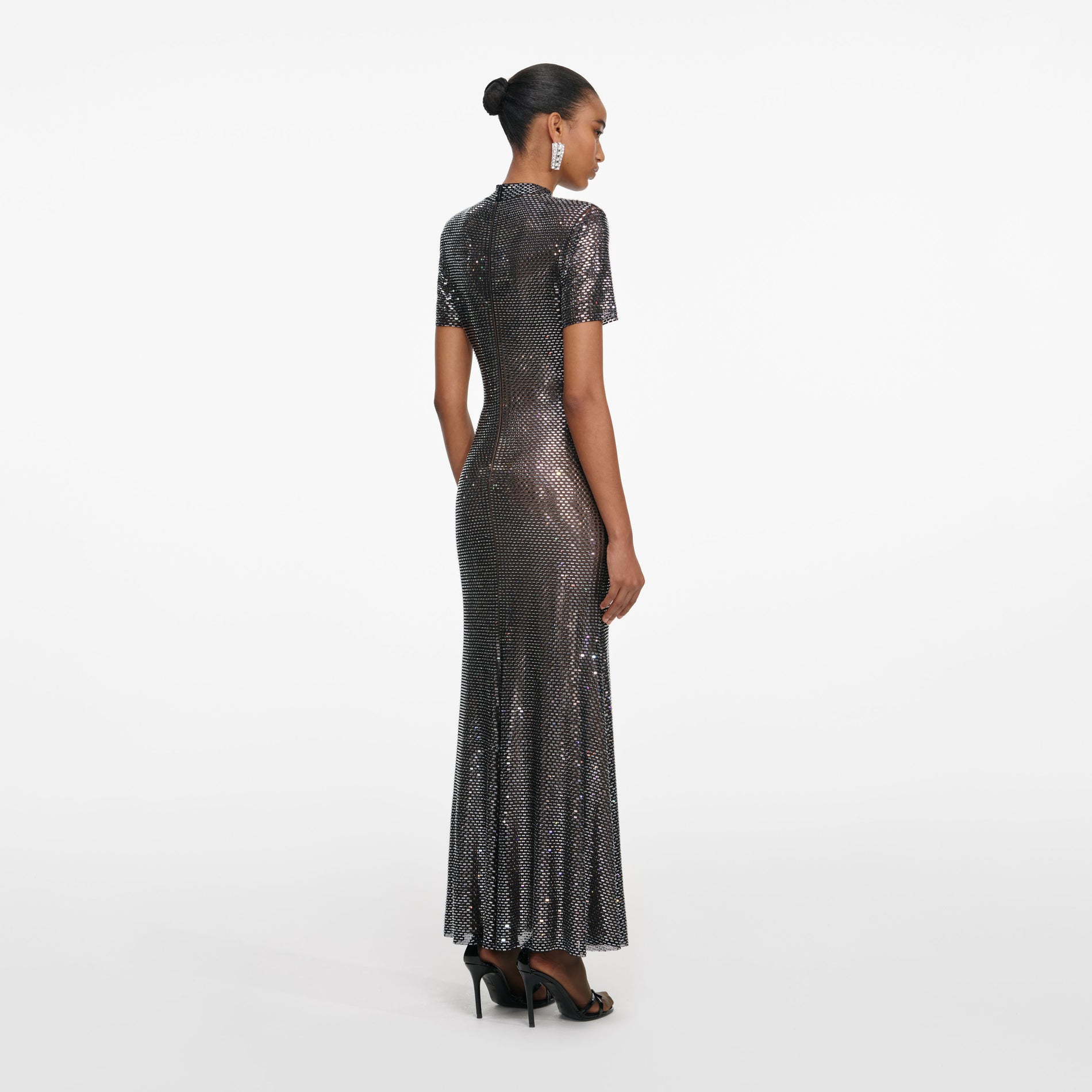 Back view of a woman wearing the Gunmetal Rhinestone Mesh Midi Dress