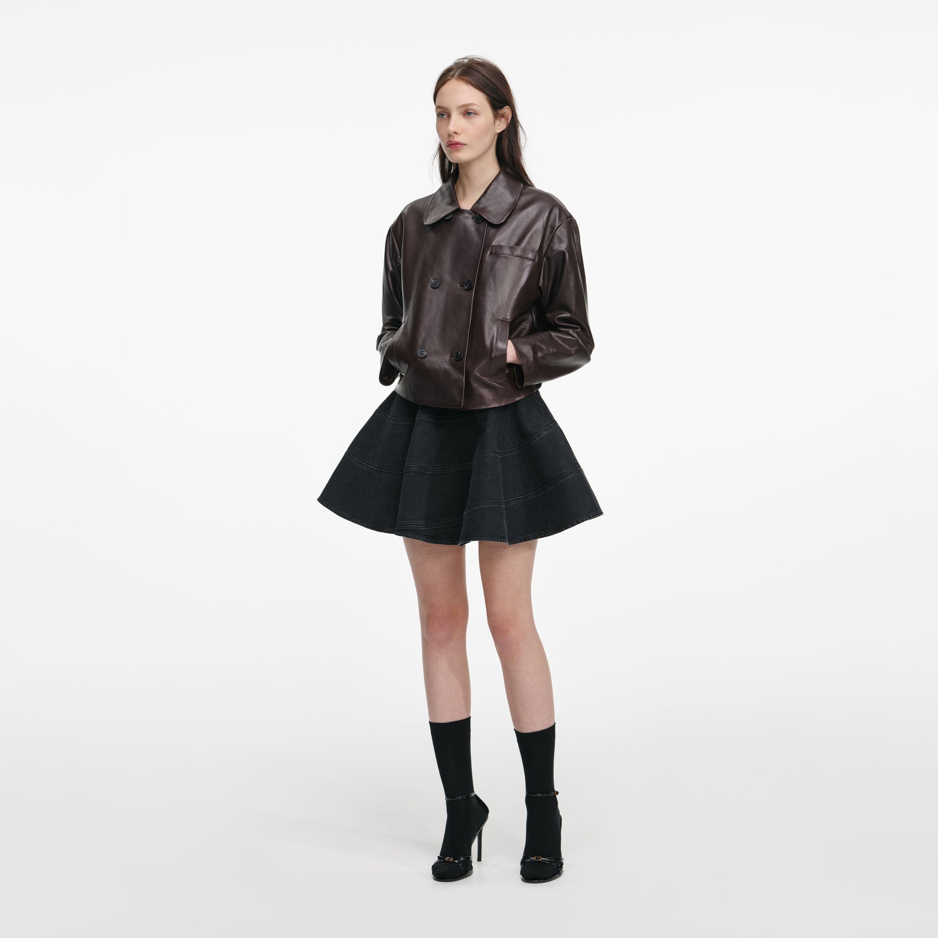 Side view of a woman wearing the Brown Cropped Leather Jacket