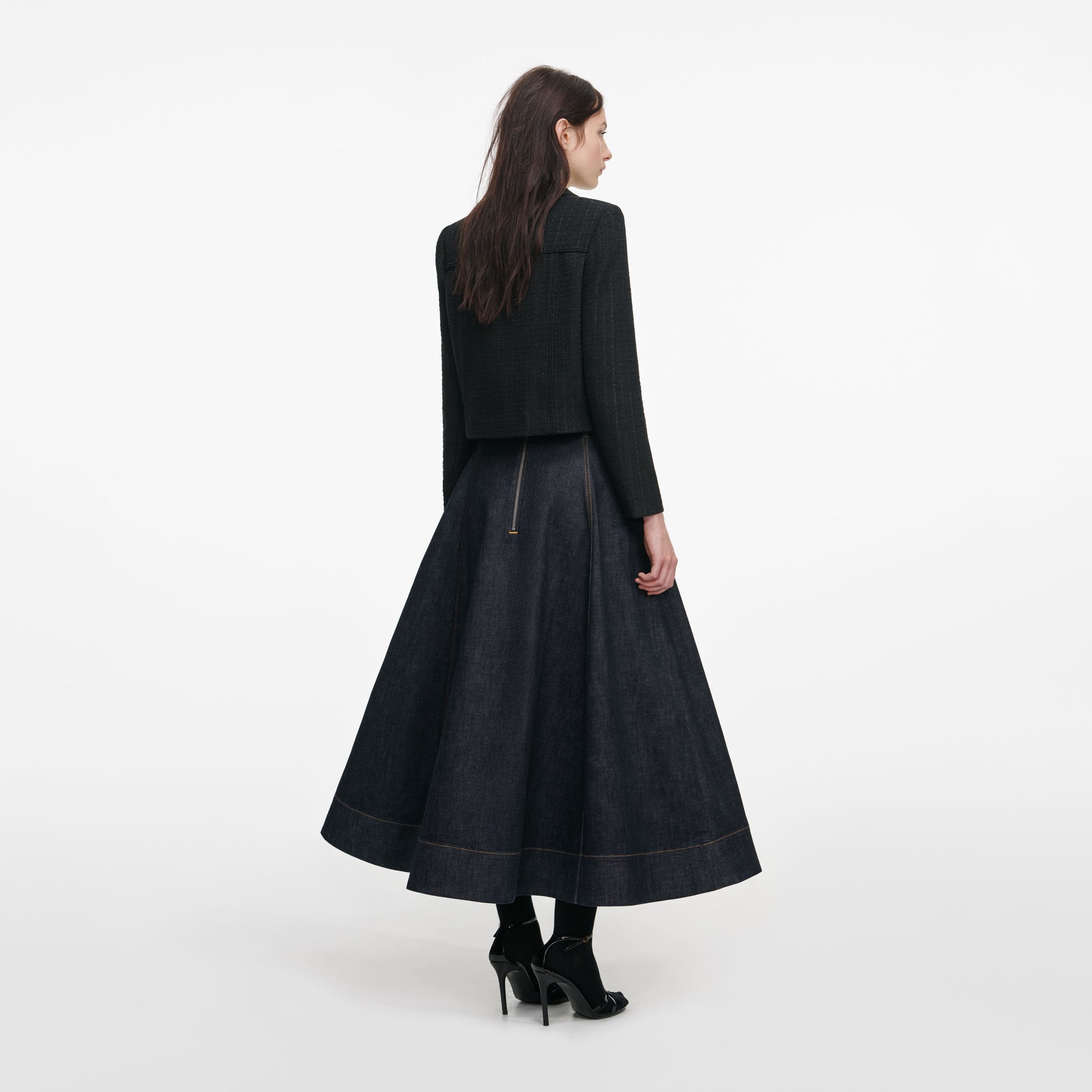 Back view of a woman wearing the Black Boucle Cropped Jacket