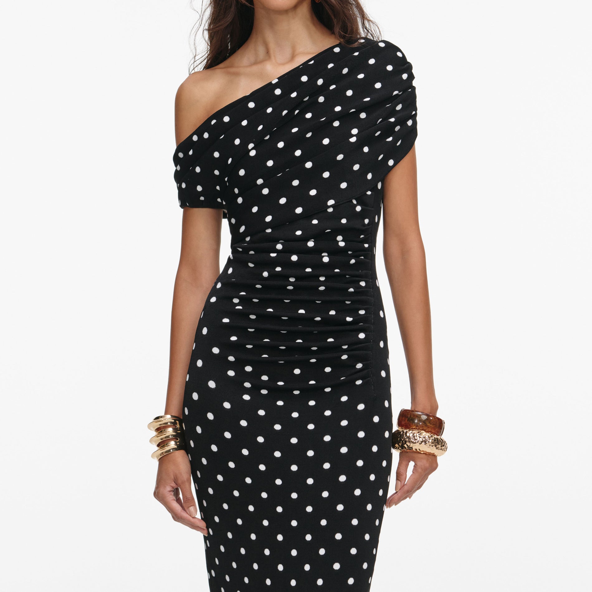 A close up of a woman wearing the Polka Dot Draped Knit Midi Dress