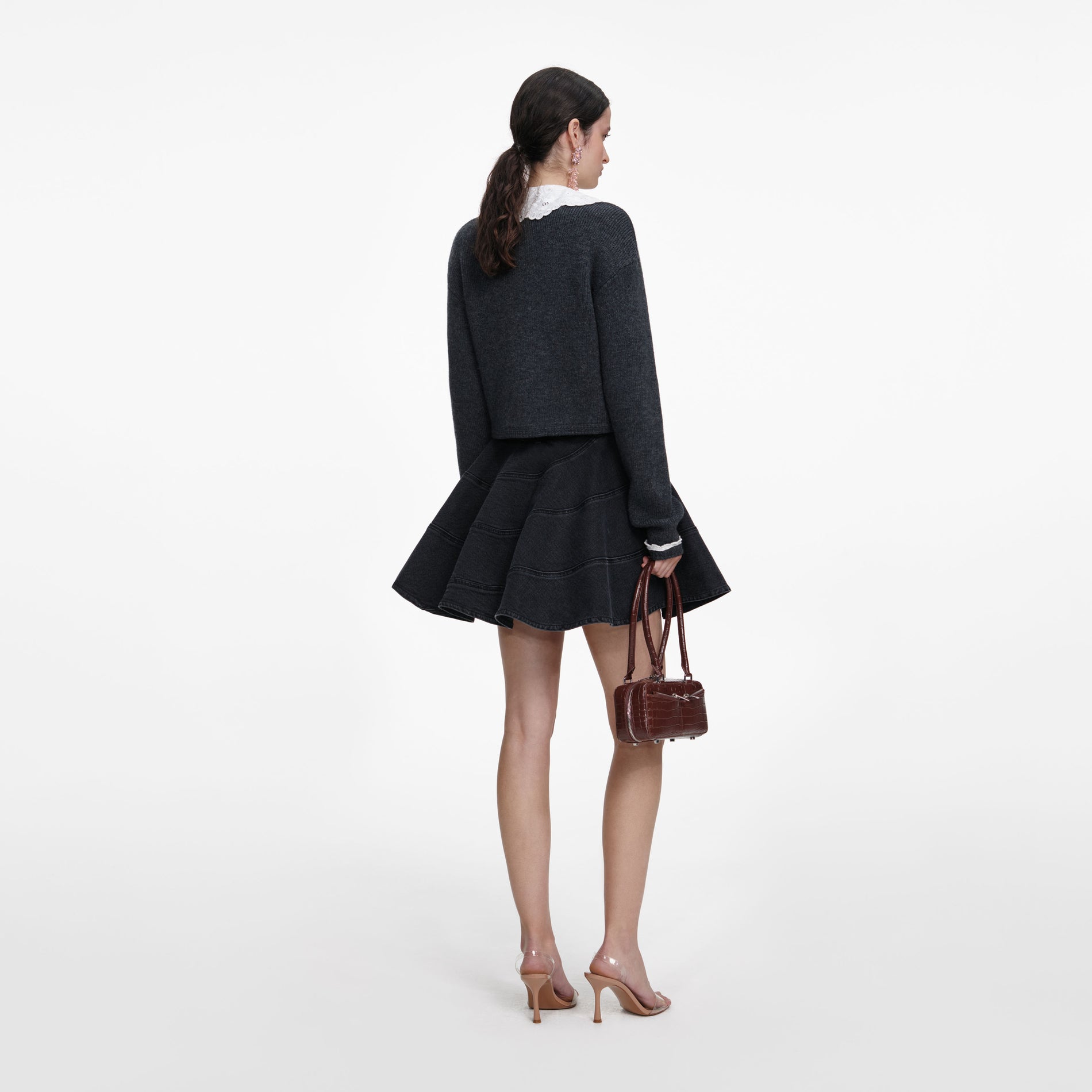 Back view of a woman wearing the Charcoal Lace Collar Cardigan