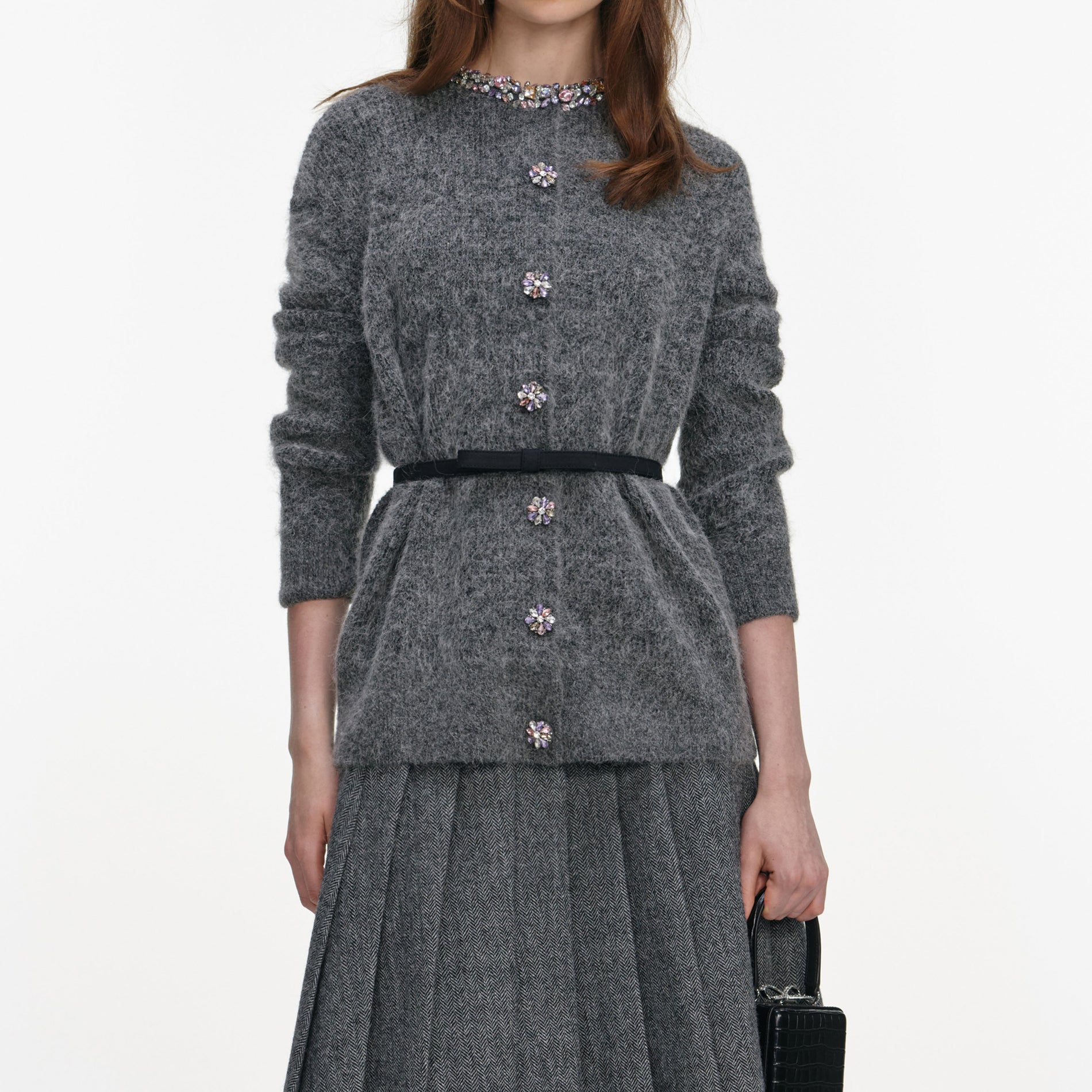 A close up of a woman wearing the Charcoal Crystal Trim Cardigan