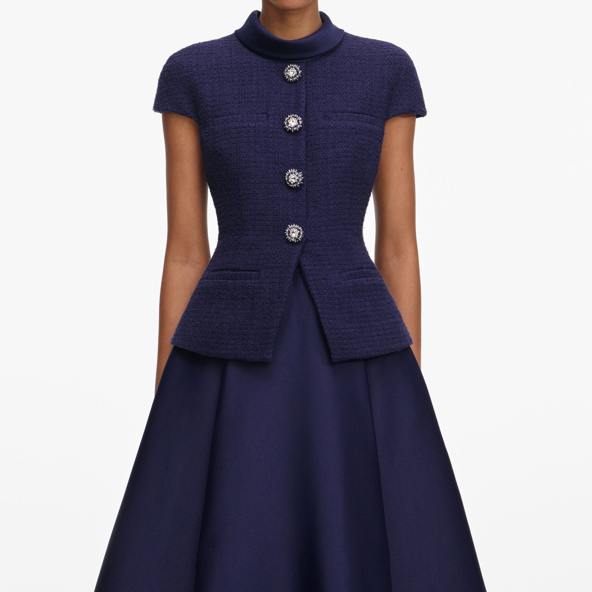A close up of a woman wearing the Navy Boucle Taffeta Midi Dress