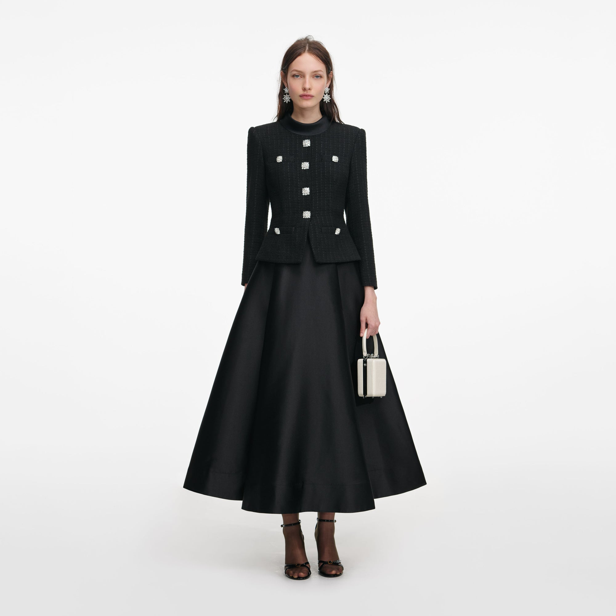 Front view of a woman wearing the Black Boucle Taffeta Midi Dress