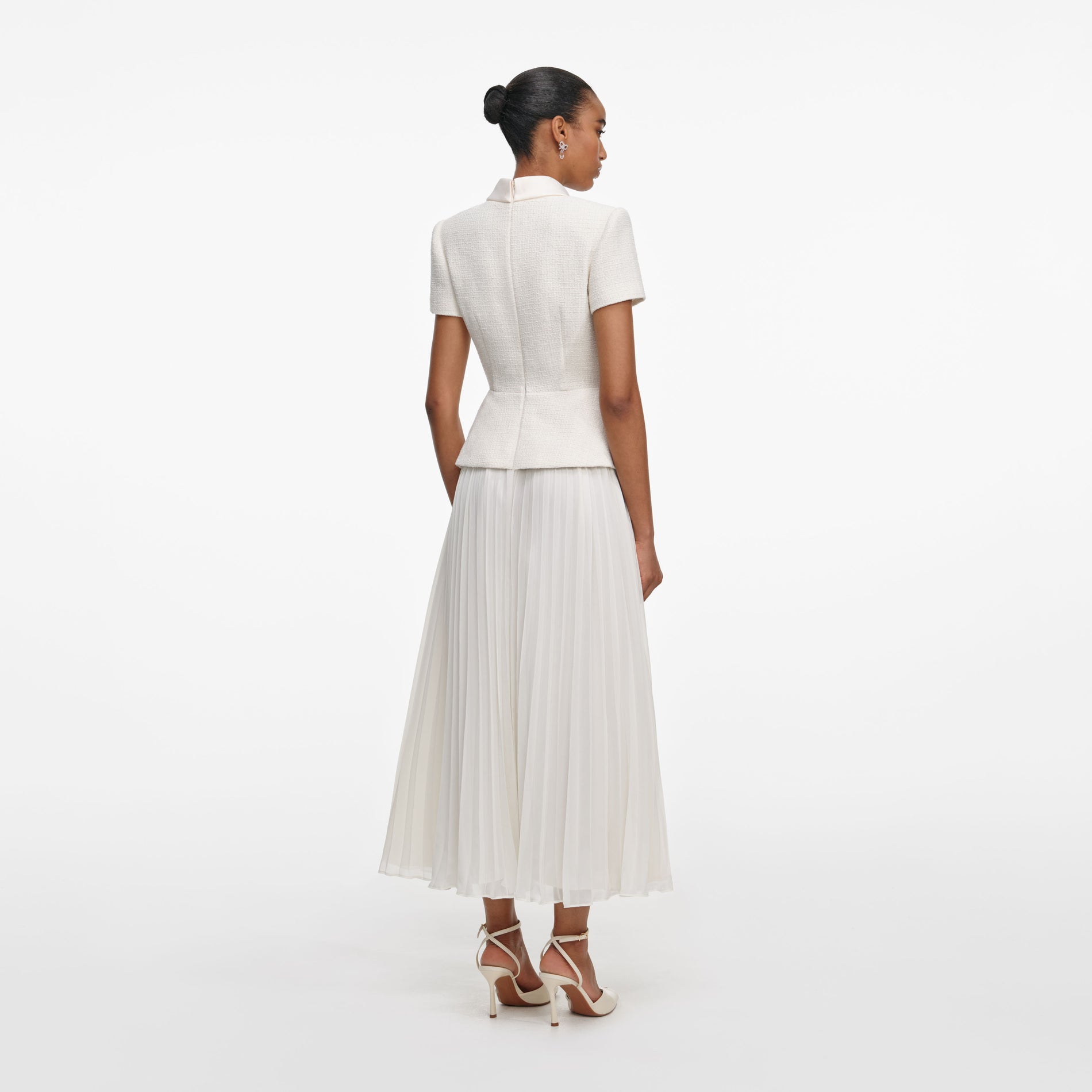 Back view of a woman wearing the Cream Boucle Collared Midi Dress