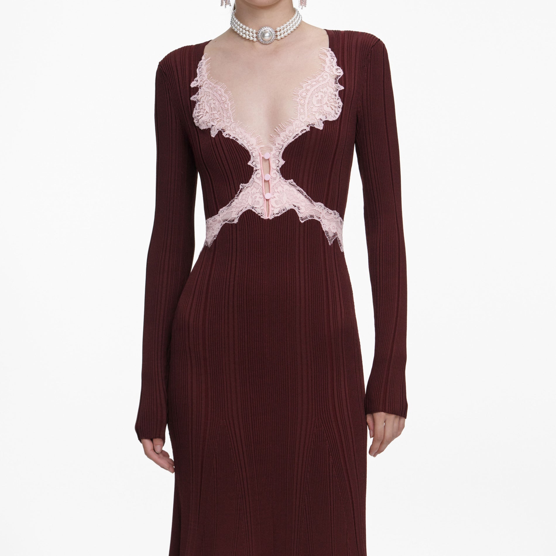 A close up of a woman wearing the Brown Contrast Lace Knit Midi Dress