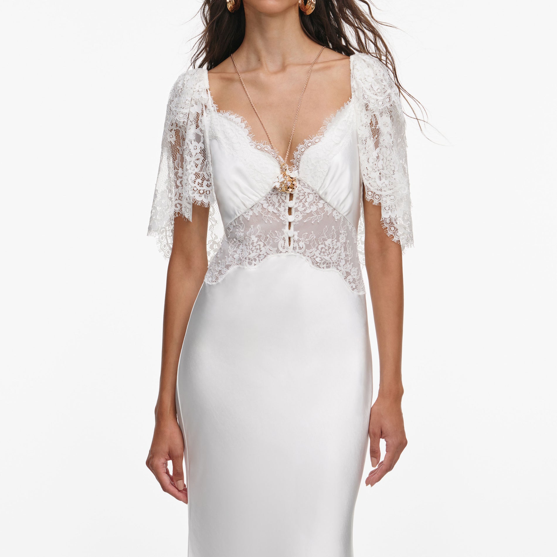 A close up of a woman wearing the White Fine Lace Satin Maxi Dress