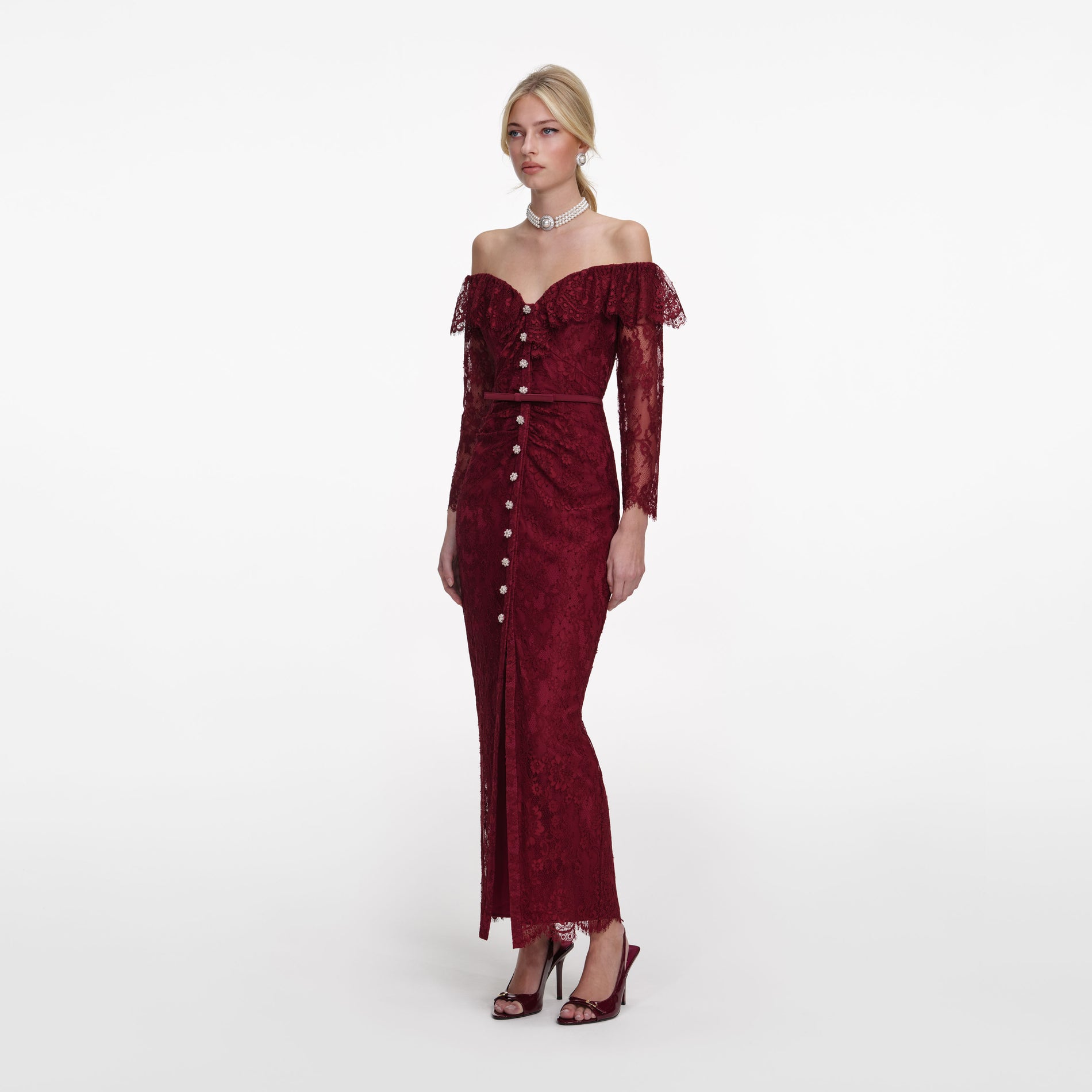 Side view of a woman wearing the Burgundy Off Shoulder Gathered Lace Maxi Dress