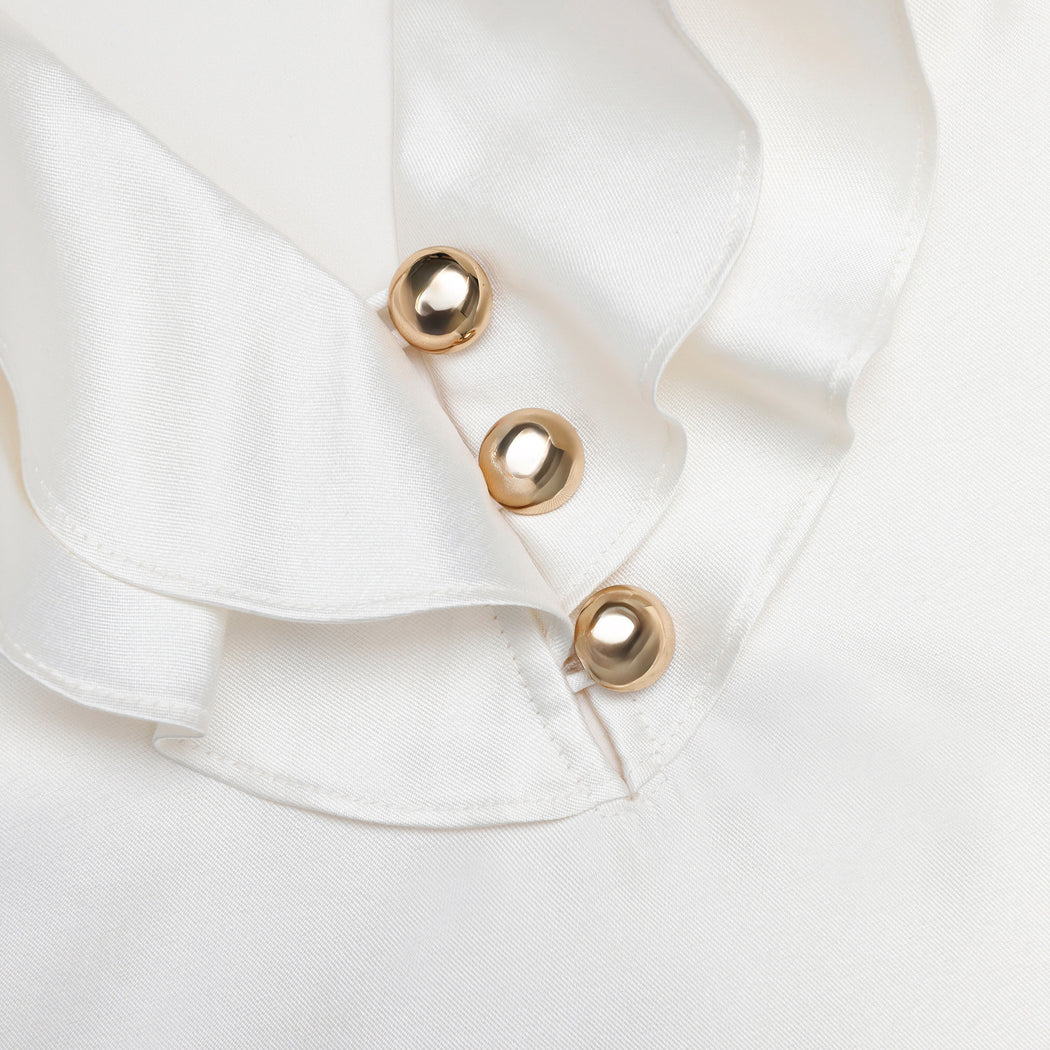 A close up of the fabric for the Cream Taffeta Ruffle Top