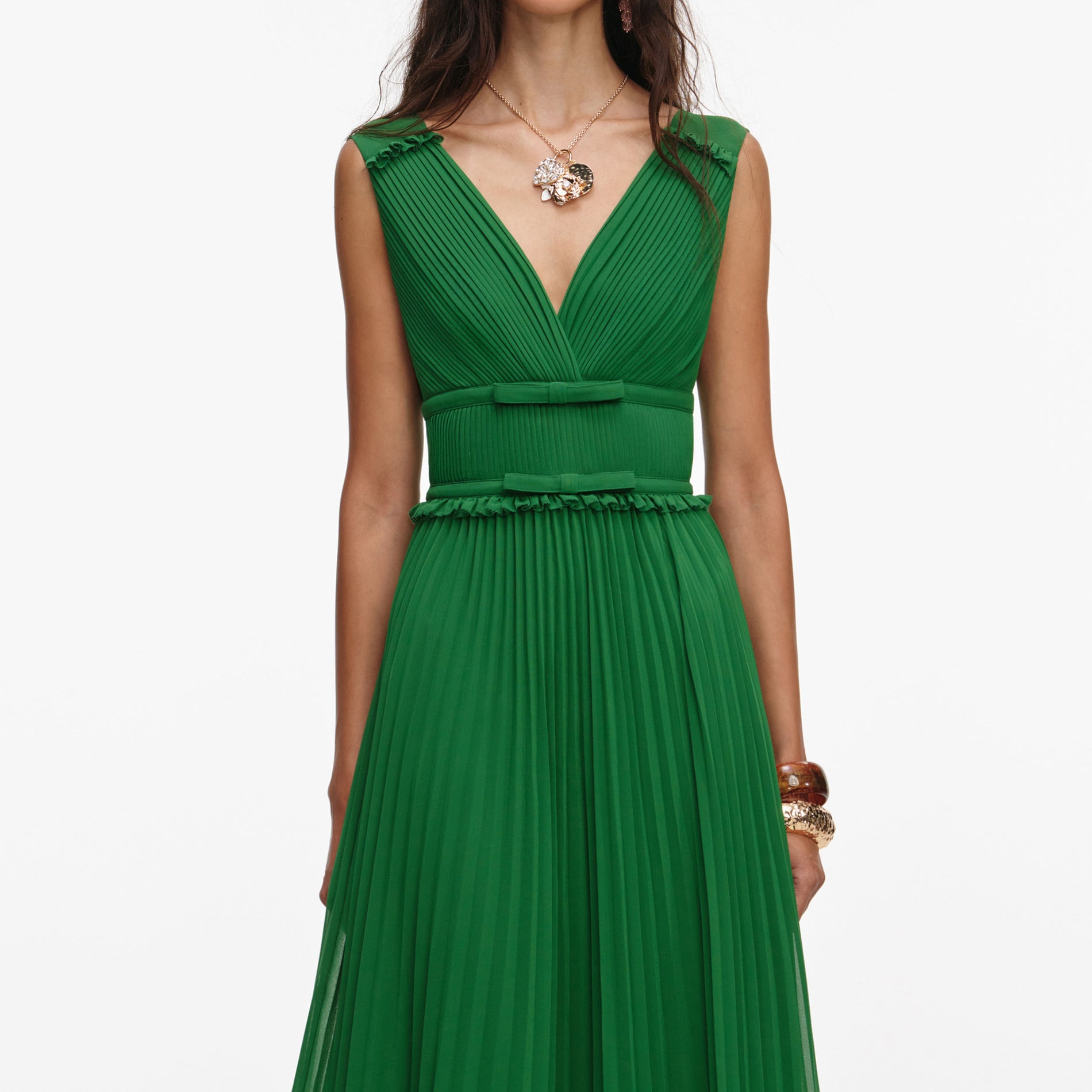 A close up of a woman wearing the Green Chiffon Midi Dress