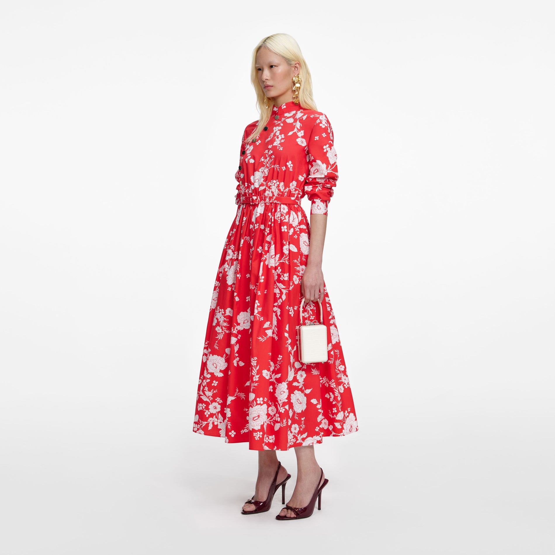 Side view of a woman wearing the Red Floral Cotton Midi Dress