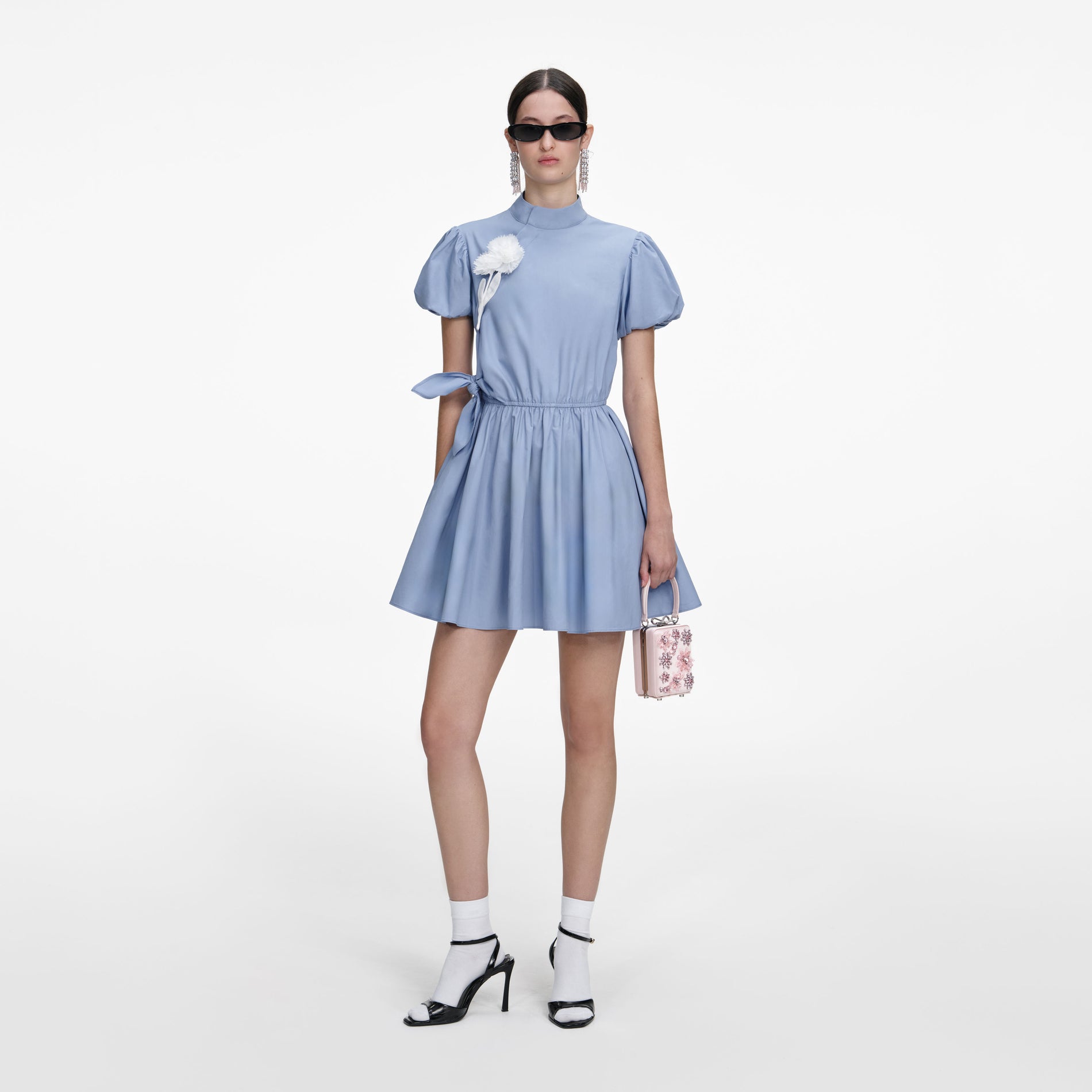 Front view of a woman wearing the Blue Cotton Drape Mini Dress