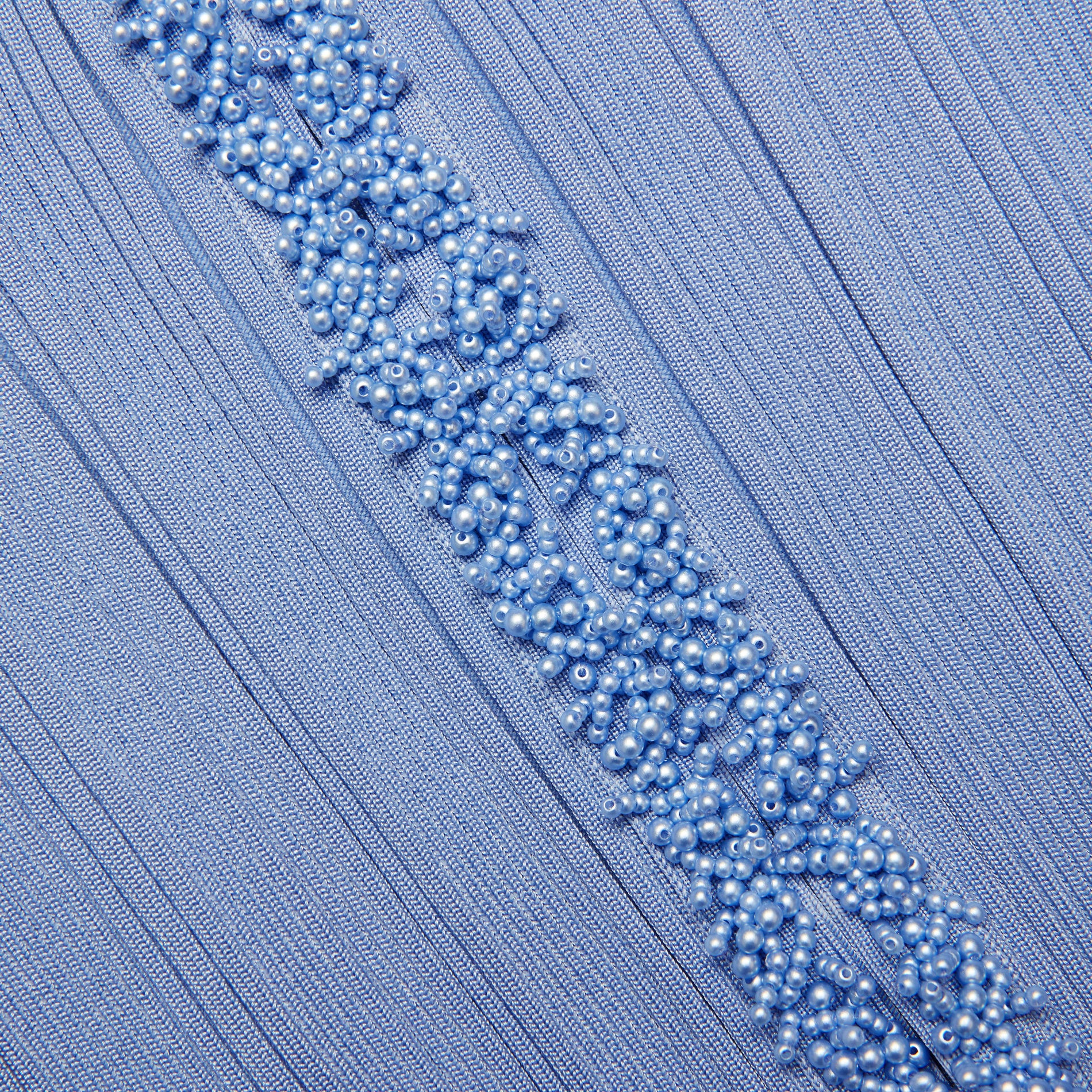 A close up of the fabric for the Blue Pearl Trim Cardigan
