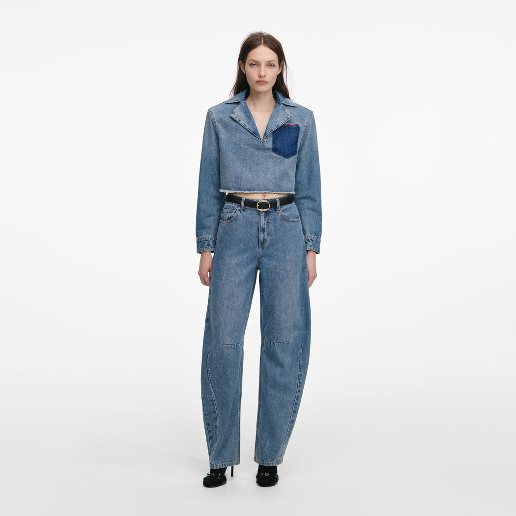 Front view of a woman wearing the Cropped Denim Shirt