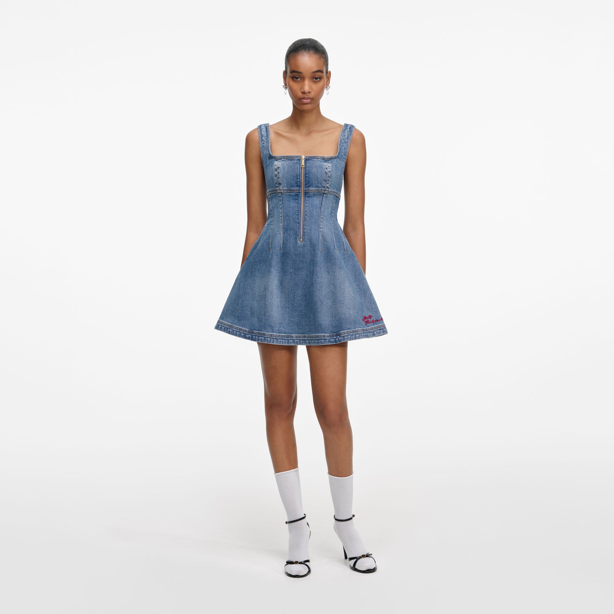 Front view of a woman wearing the Denim Mini Dress