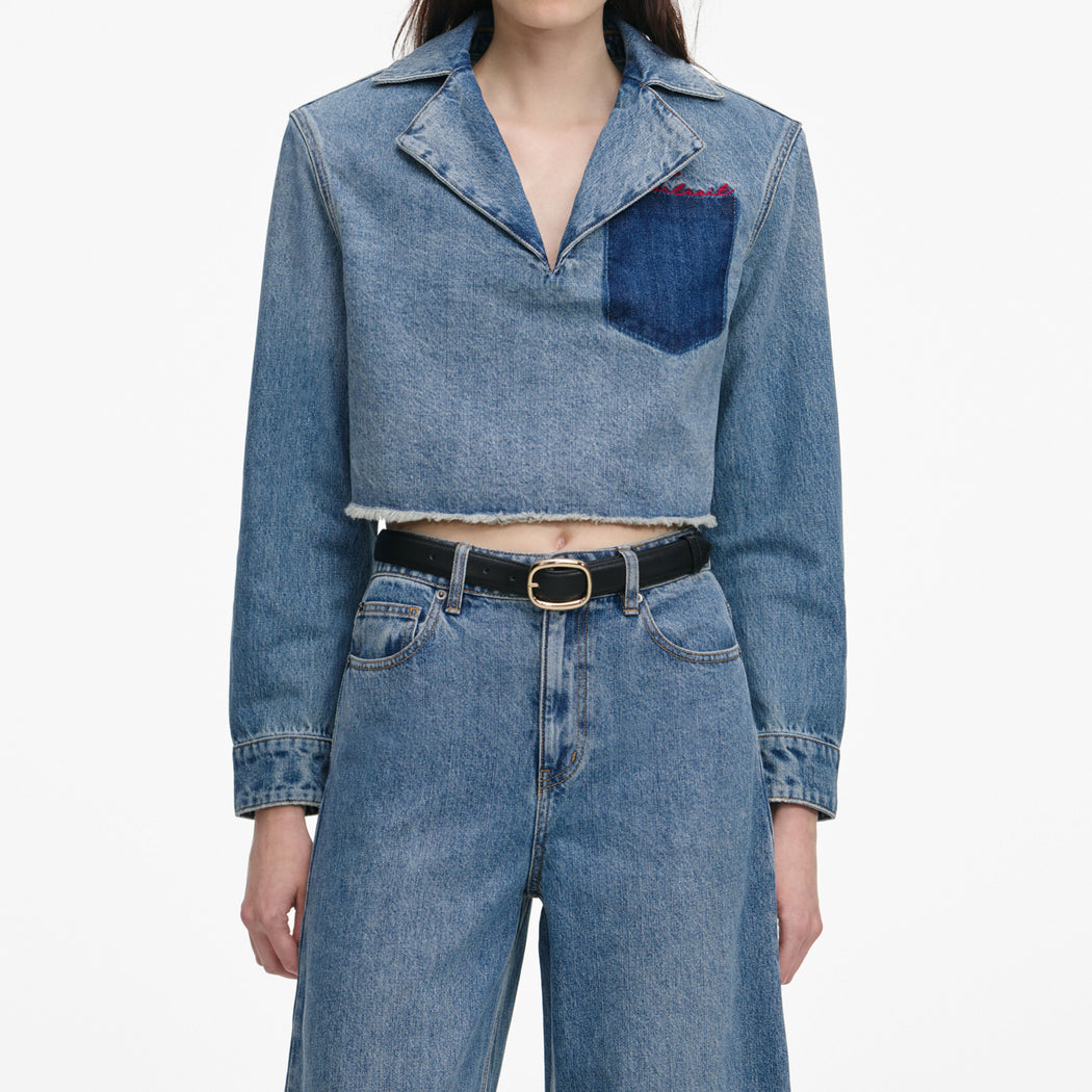 A close up of a woman wearing the Blue Barrel Leg Jeans
