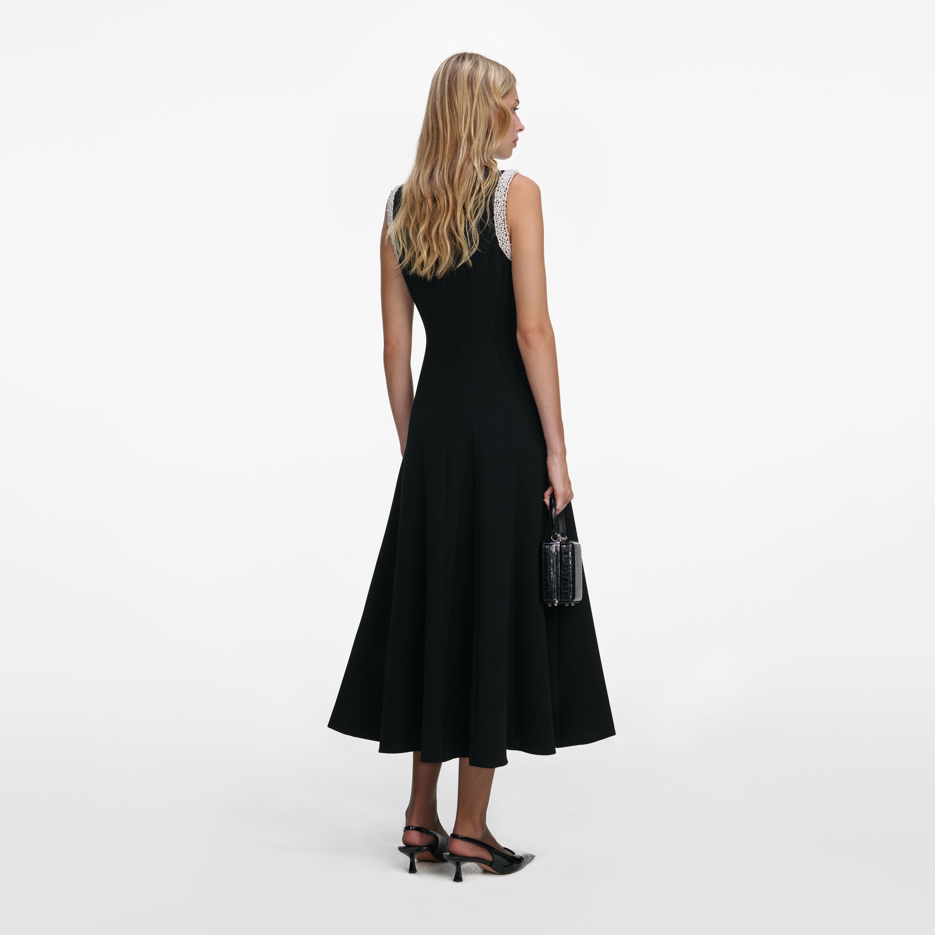 Back view of a woman wearing the Black Crepe Pearl Trim Midi Dress