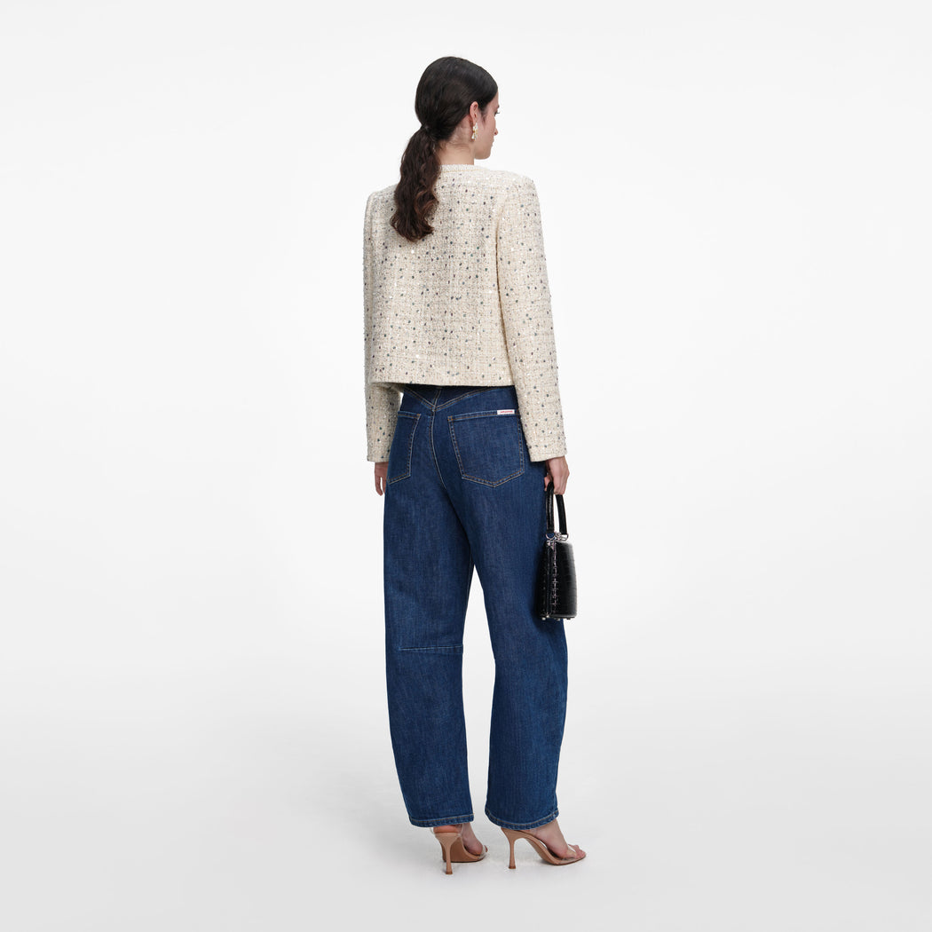 Back view of a woman wearing the Cream Embellished Boucle Jacket