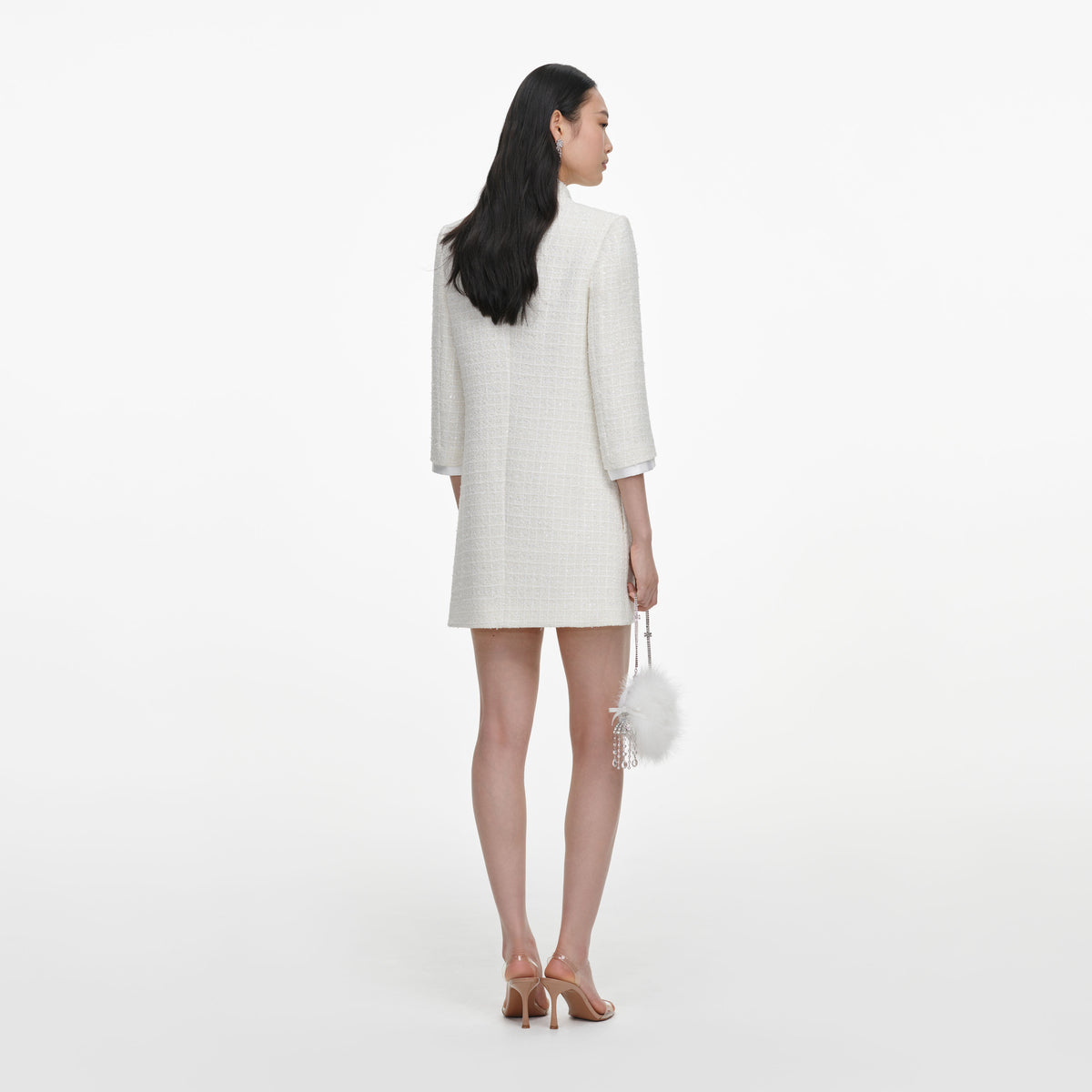 Back view of a woman wearing the Cream Boucle Mini Dress