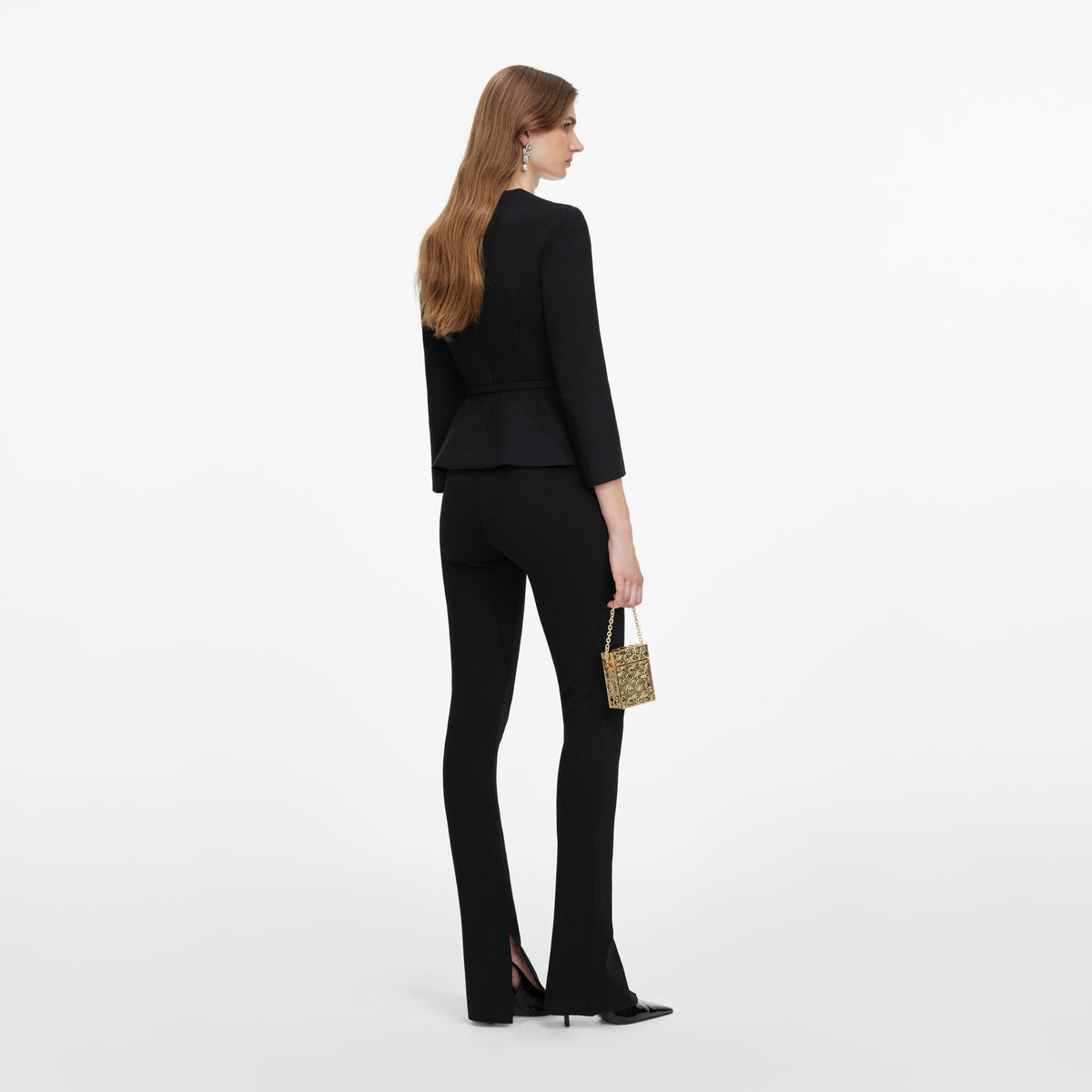 Back view of a woman wearing the Black Tailored Brooch Top