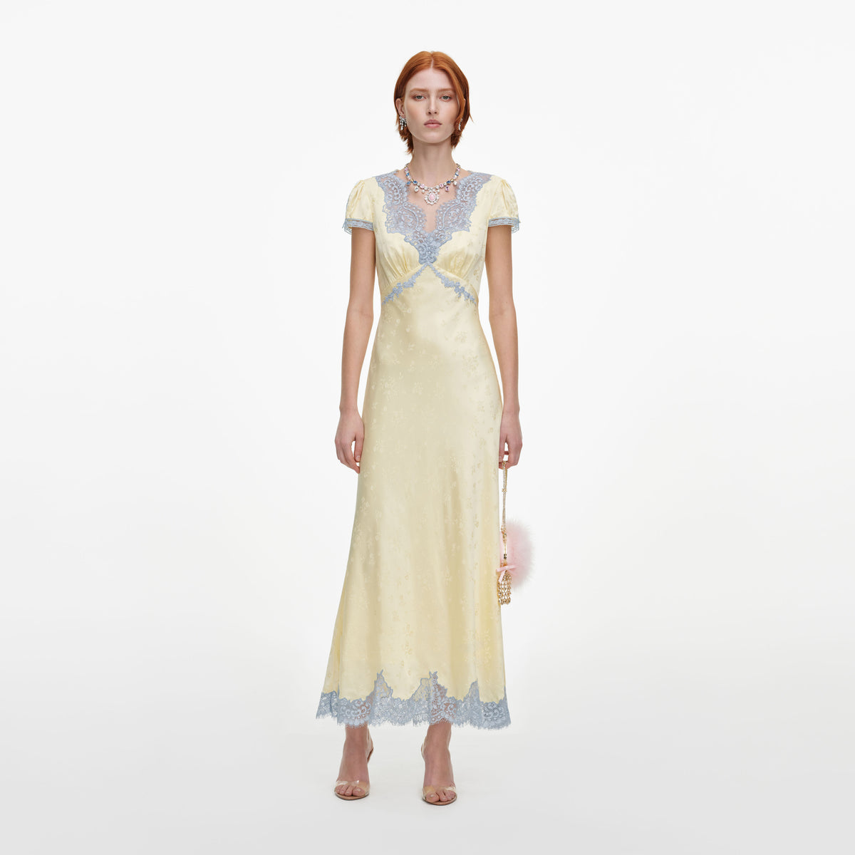 Front view of a woman wearing the Yellow Viscose Lace Midi Dress