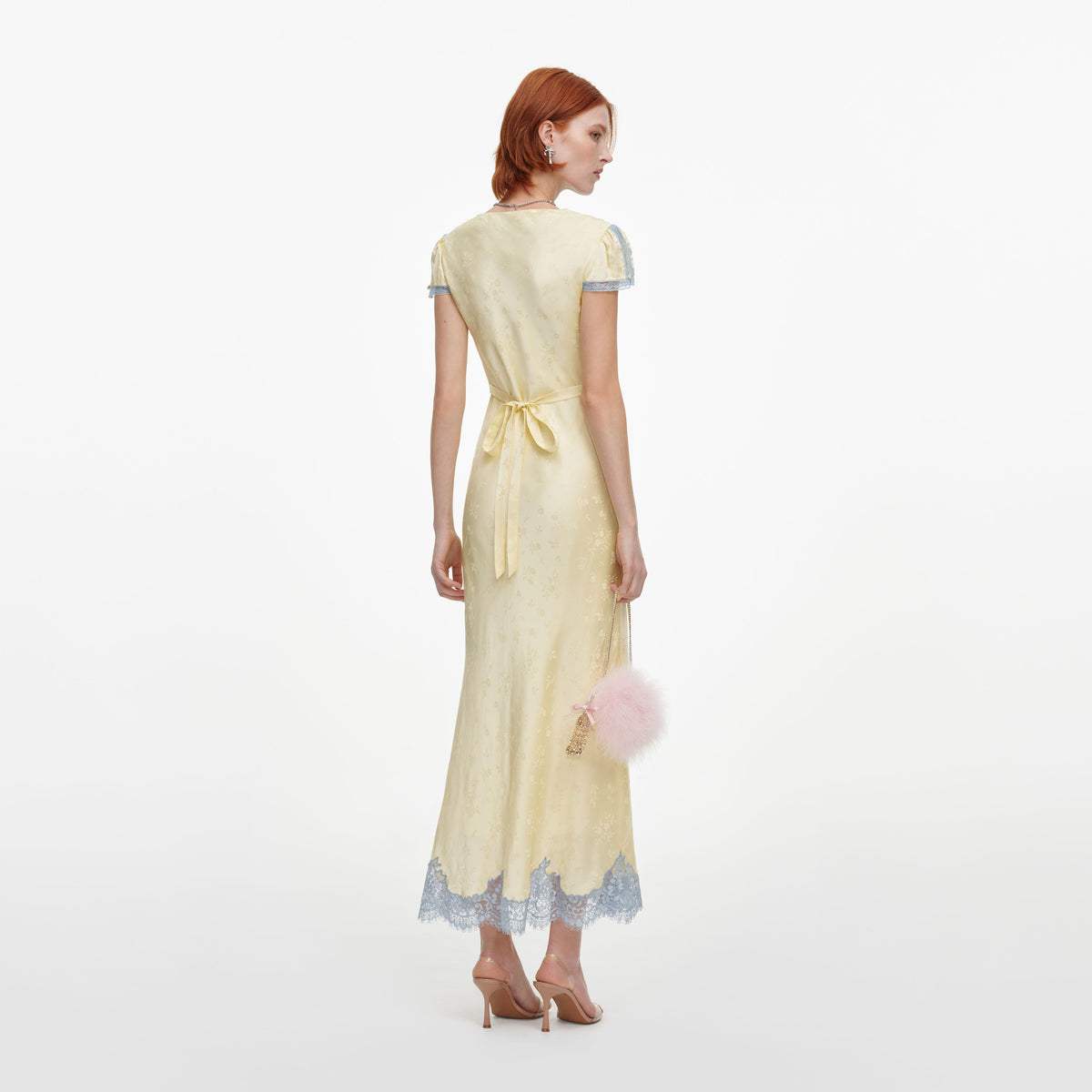 Back view of a woman wearing the Yellow Viscose Lace Midi Dress