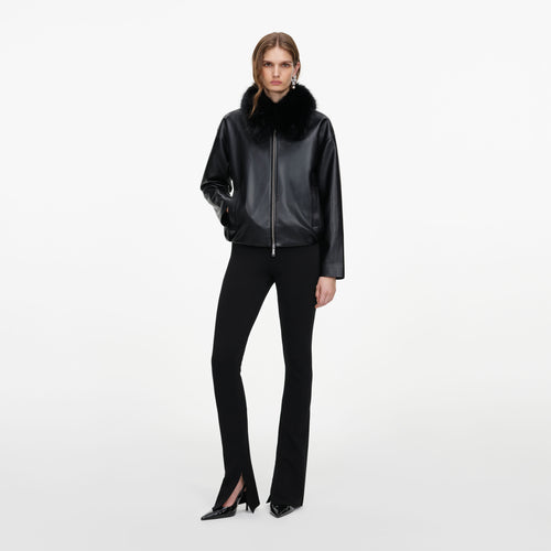 Front view of a woman wearing the Black Faux Leather Bomber Jacket
