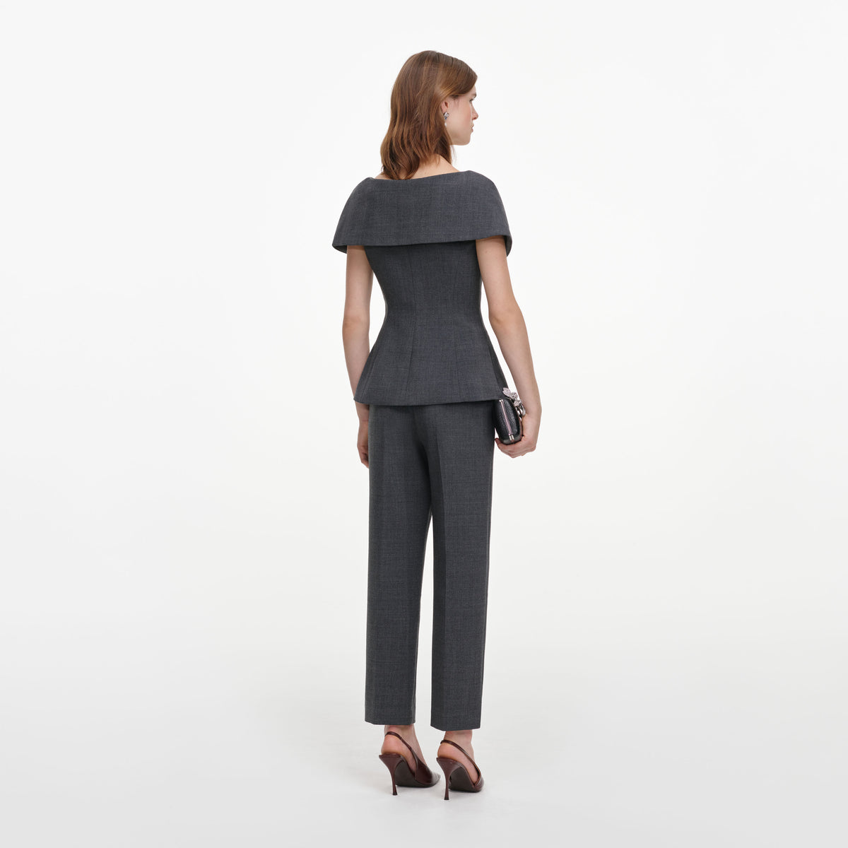 Back view of a woman wearing the Grey Tailored Brooch Jumpsuit