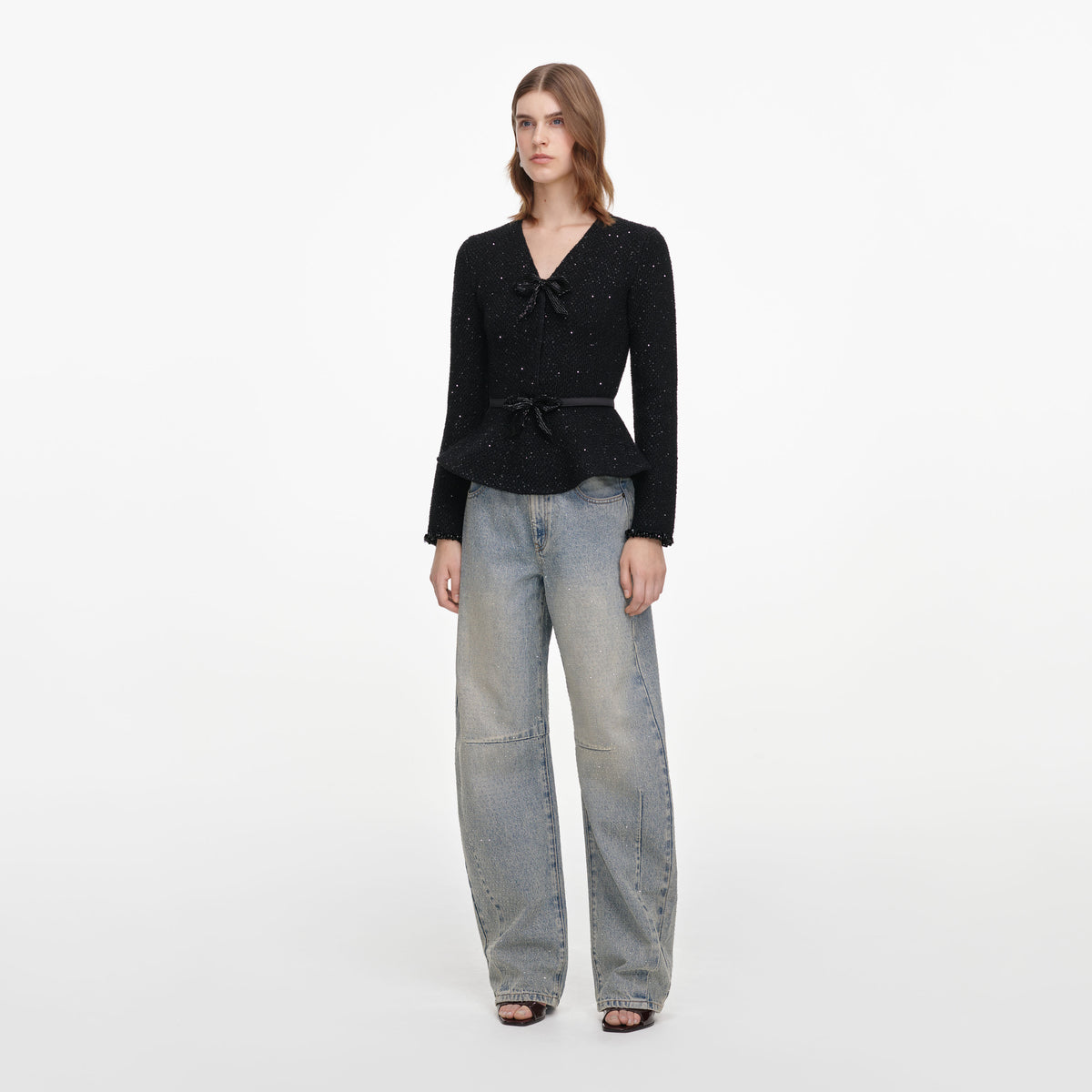 Back view of a woman wearing the Black Sequin Knit Top