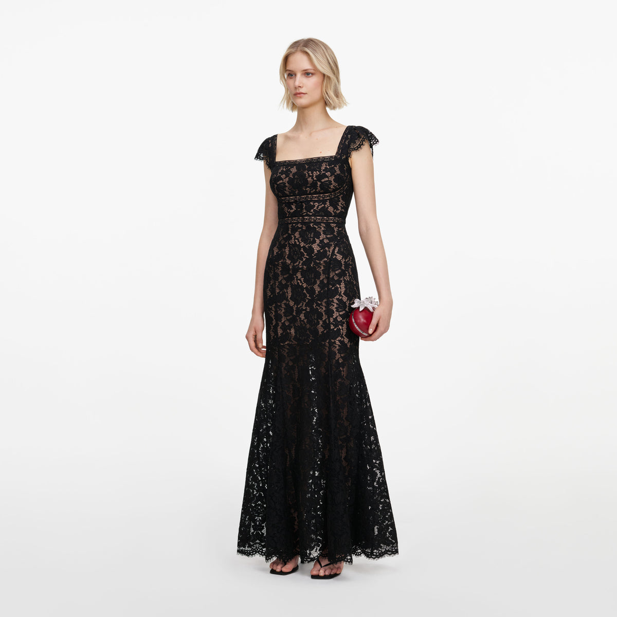Side view of a woman wearing the Black Lace Square Neck Maxi Dress