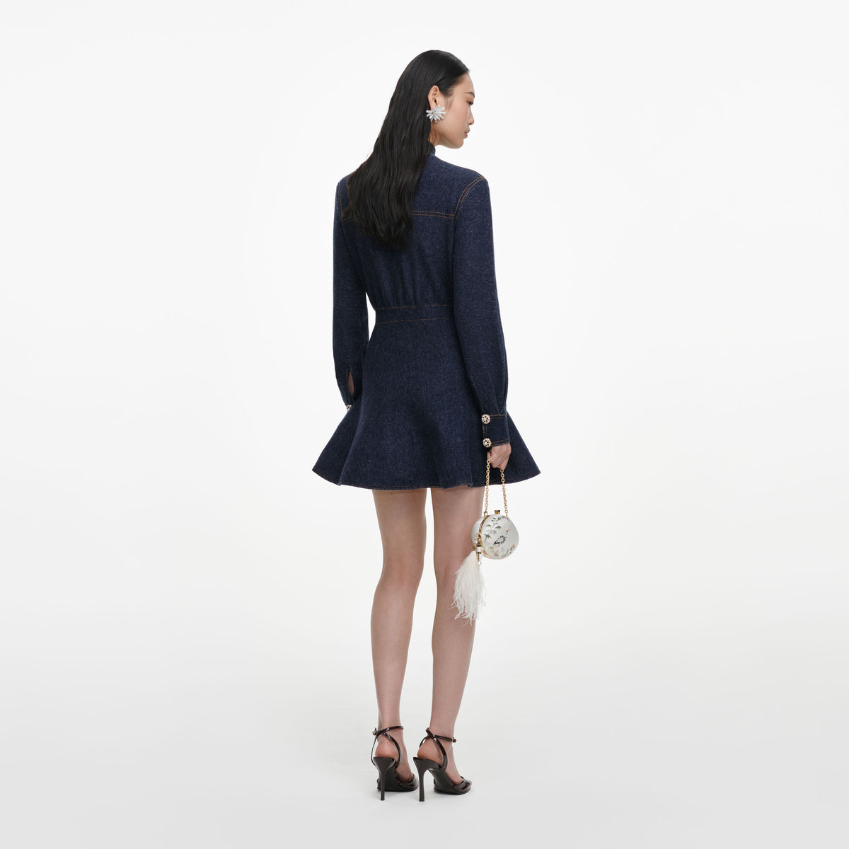 Back view of a woman wearing the Navy Textured Knit Mini Dress