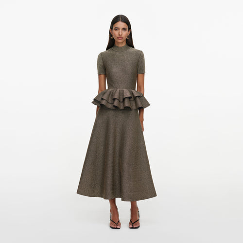 Front view of a woman wearing the Bronze Peplum Knit Midi Dress